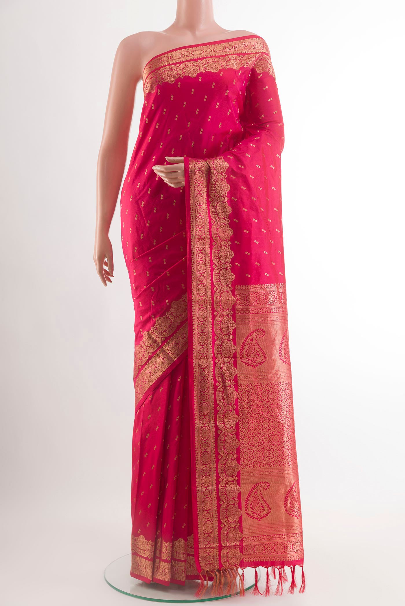 Pink Kanjivaram Silk Saree with Zari Butta on the body and Zari Border.  displayed on a mannequin
