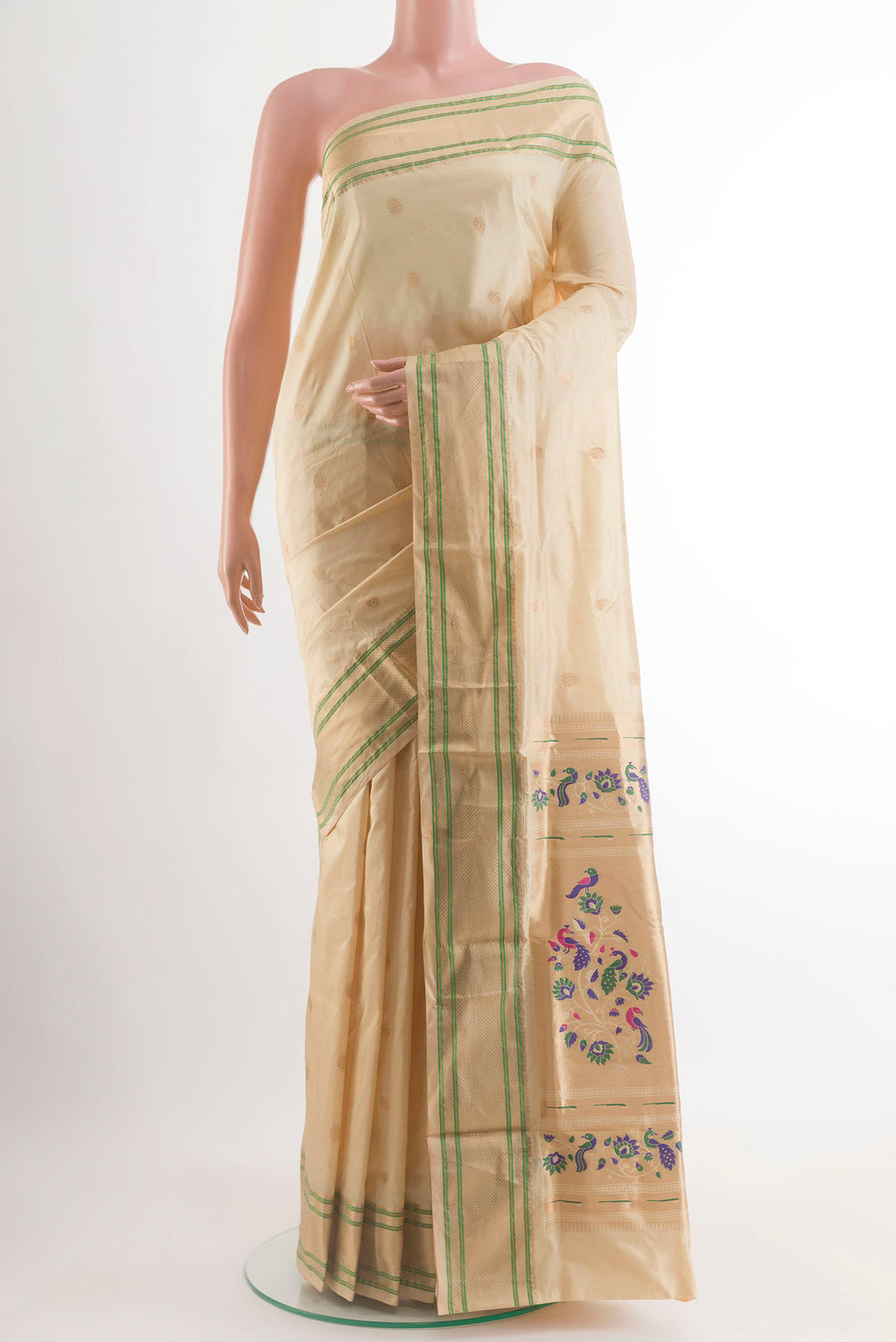 Cream Paithani Silk Saree with Zari Butta on the body and Zari Border.  displayed on a mannequin