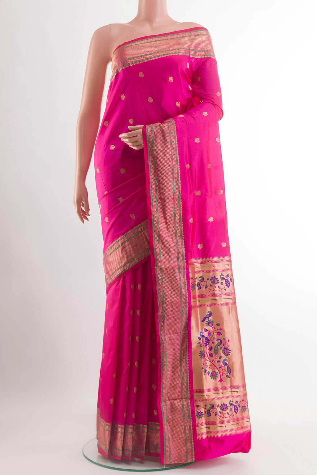 Rani Pink Paithani Silk Saree with Zari Butta on the body and Zari Border.  displayed on a mannequin