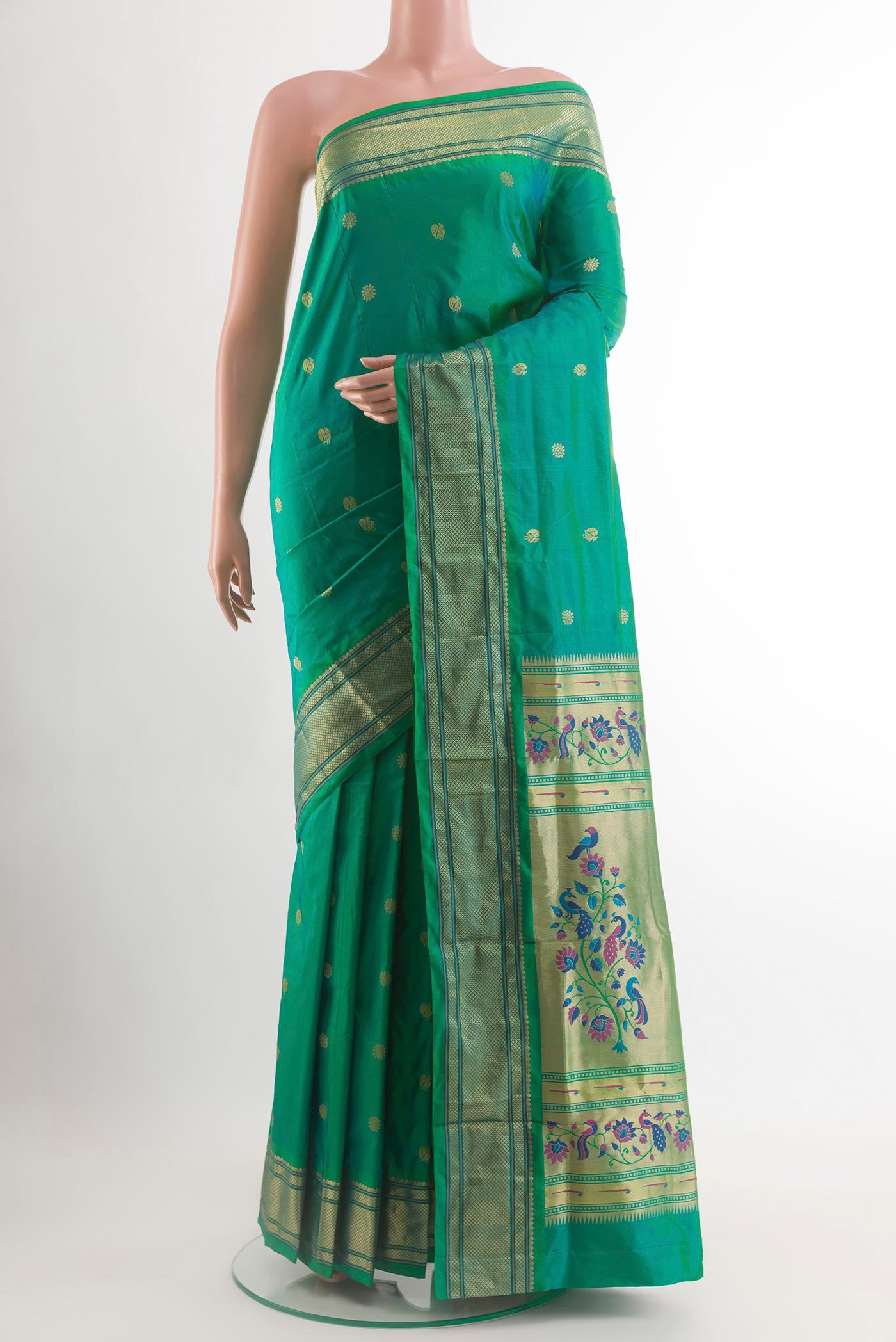 Sea Green Paithani Silk Saree with Zari Butta on the body and Zari Border.  displayed on a mannequin