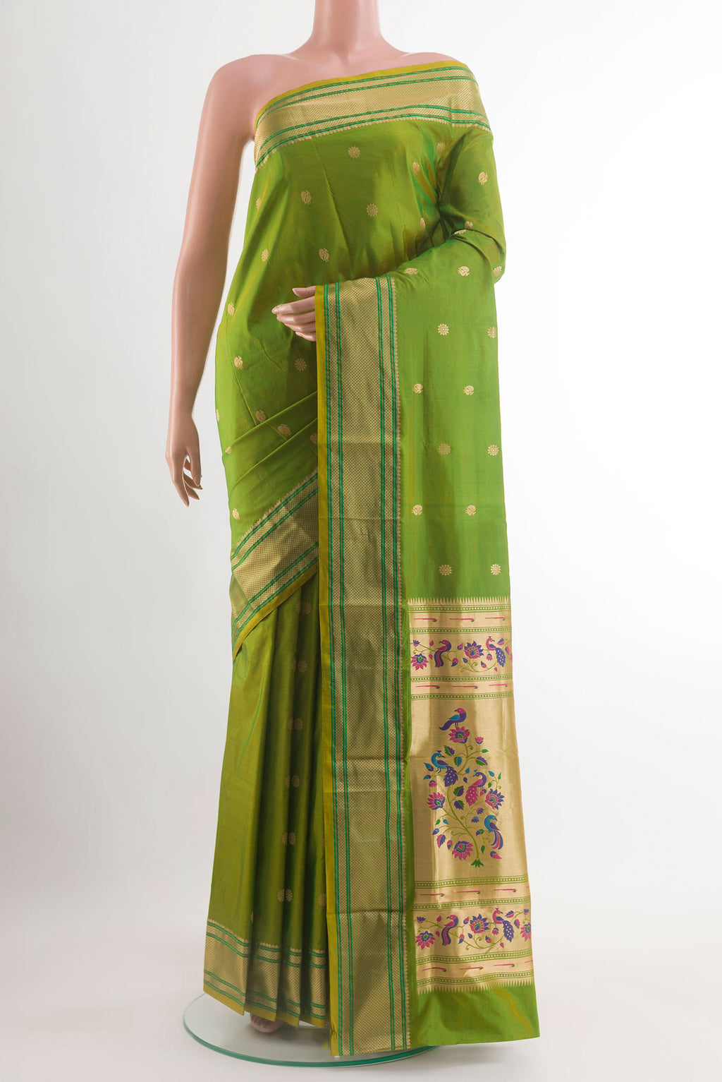 Green Paithani Silk Saree with Zari Butta on the body and Zari Border.  displayed on a mannequin