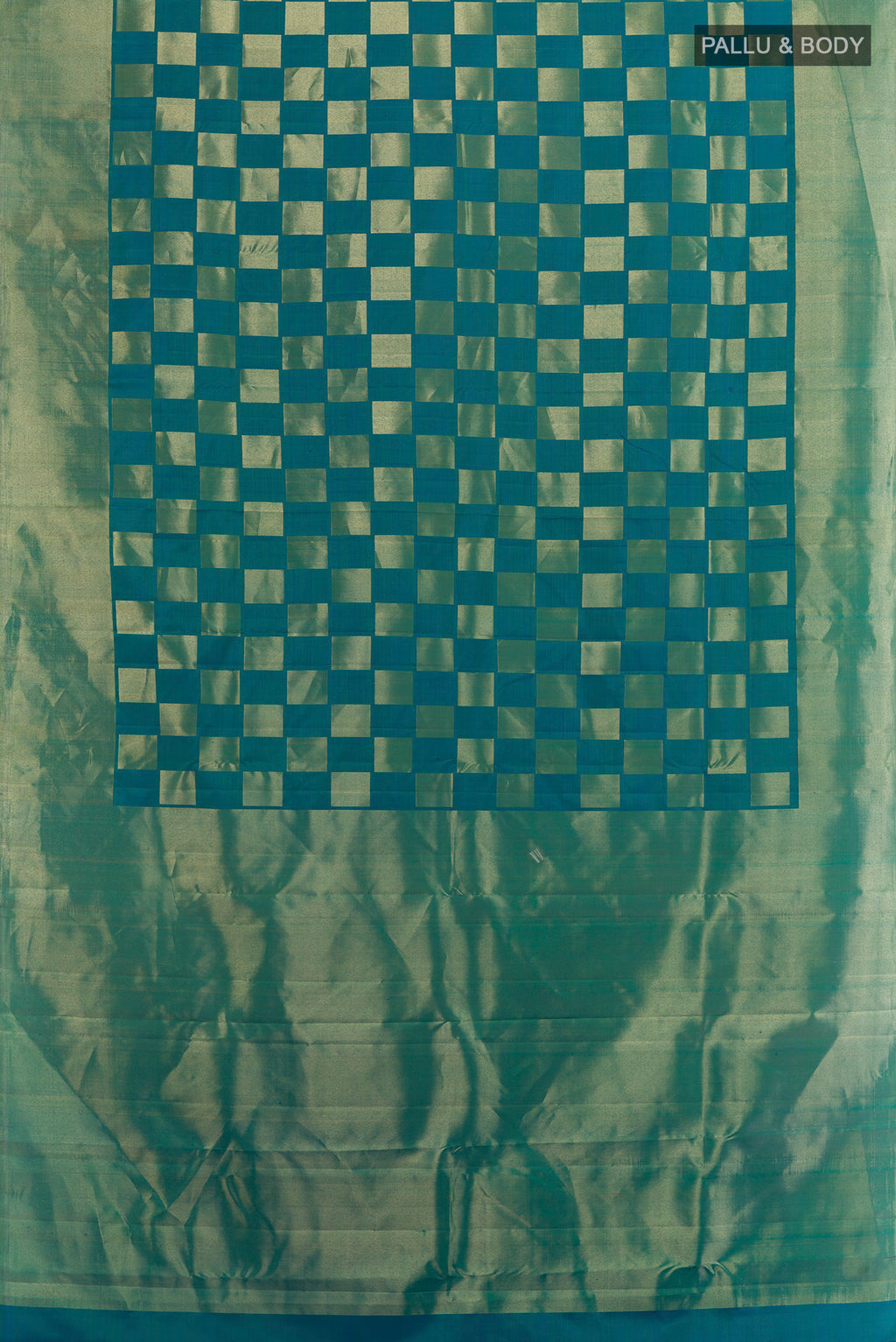 Flat view of Peacock Blue Dual Tone Kanchipuram Silk Saree with Zari Brocade on the body and Zari Border. 