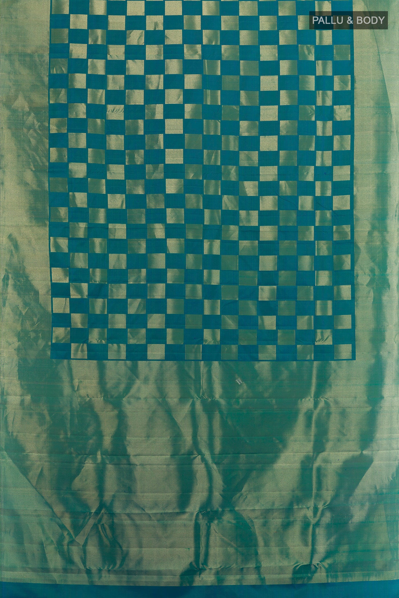 Flat view of Peacock Blue Dual Tone Kanchipuram Silk Saree with Zari Brocade on the body and Zari Border. 