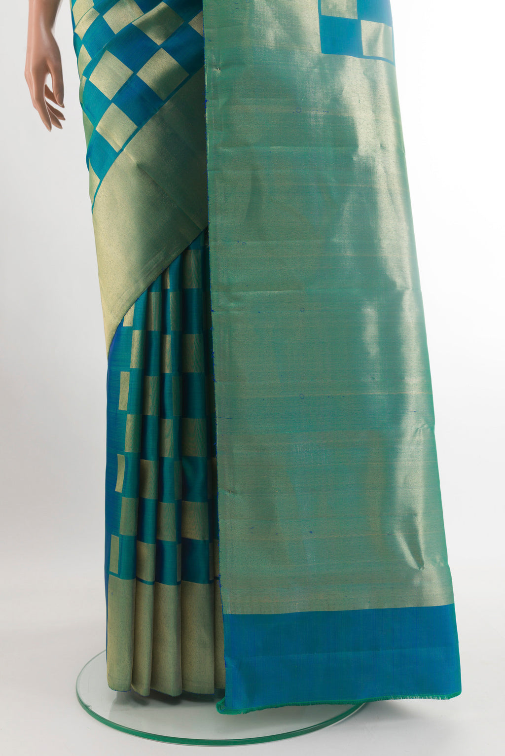 Pleats and pallu of Peacock Blue Dual Tone Kanchipuram Silk Saree with Zari Brocade on the body and Zari Border. 