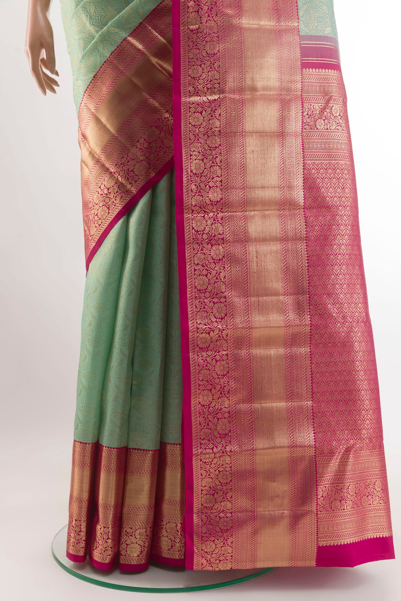 Pleats and pallu of Mint Green Kanchipuram Silk Saree with Zari Brocade on the body and Zari Border. 