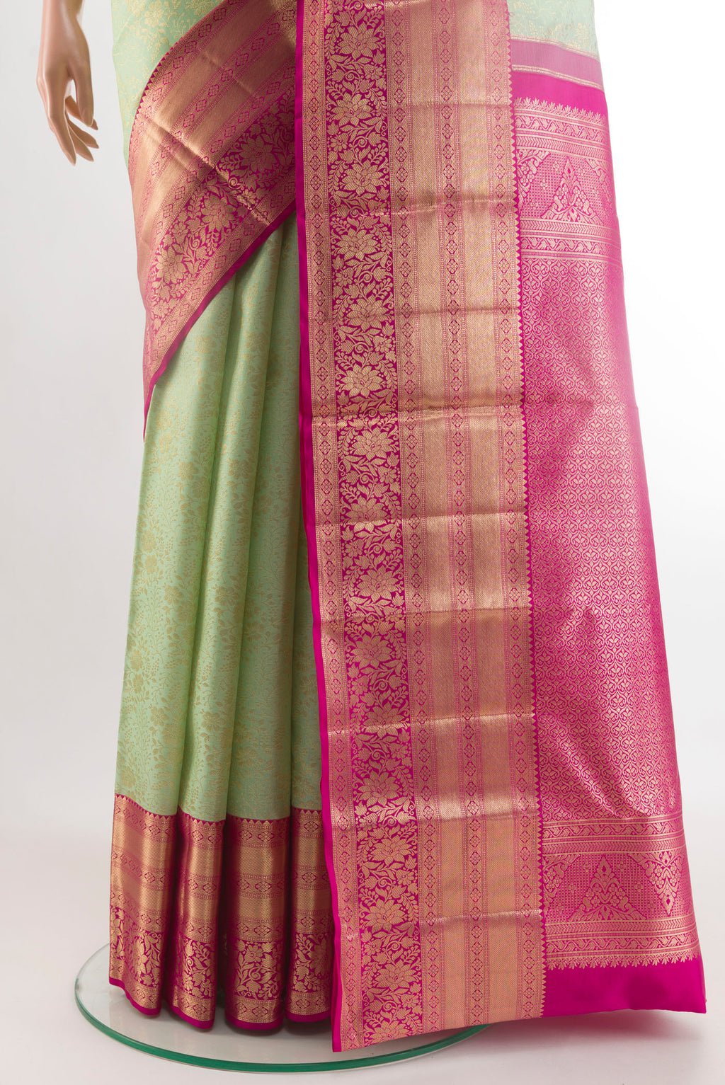 Pleats and pallu of Light Green Kanchipuram Silk Saree with Zari Brocade on the body and Zari Border. 