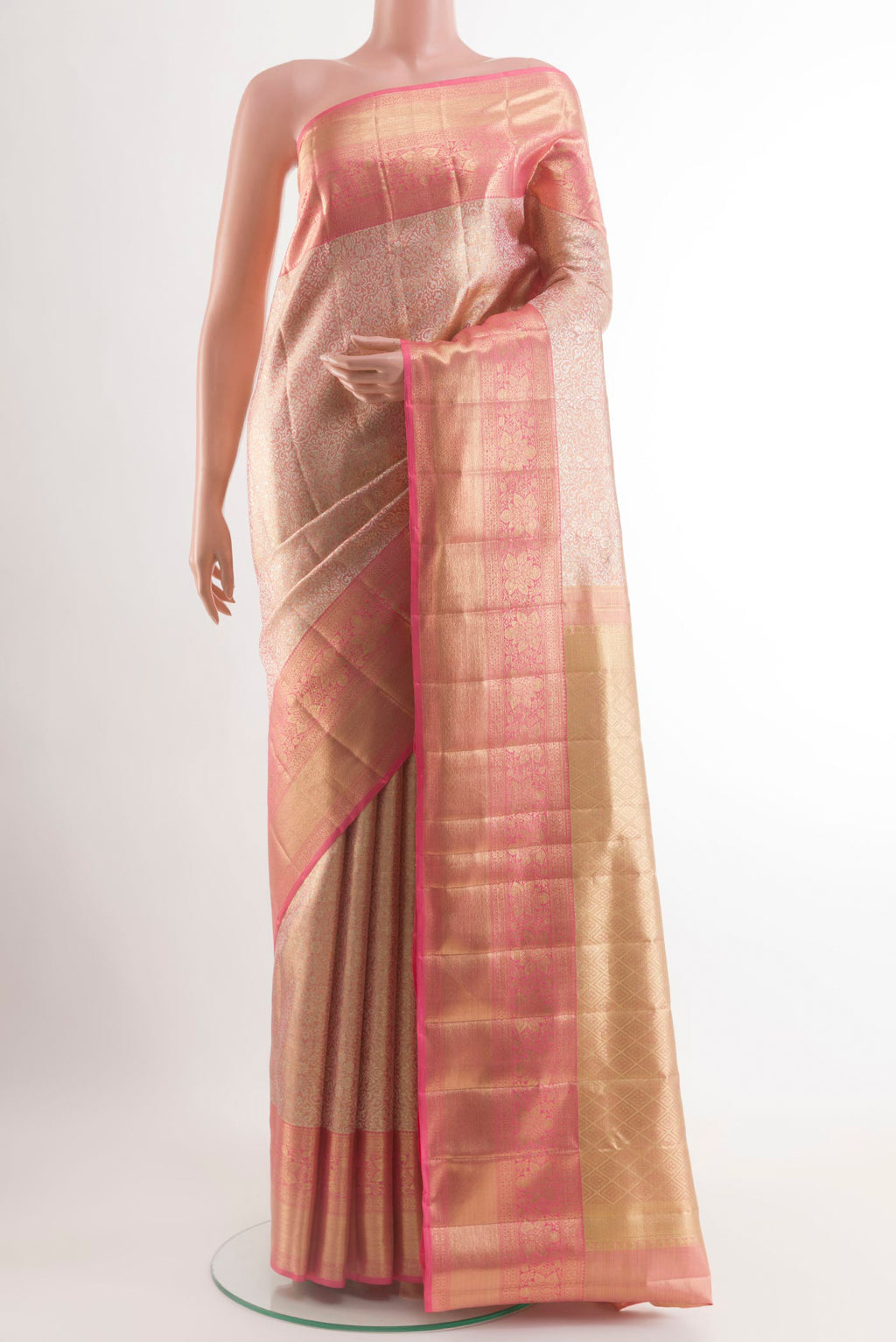 Rose Gold Kanjivaram Tissue Silk Saree with Zari Brocade on the body and Zari Border.  displayed on a mannequin