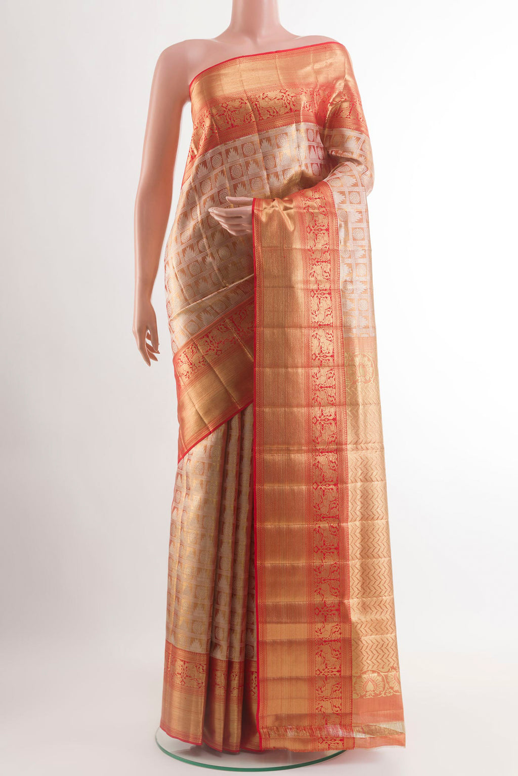 Gold Kanjivaram Tissue Silk Saree with Zari Brocade on the body and Zari Border.  displayed on a mannequin