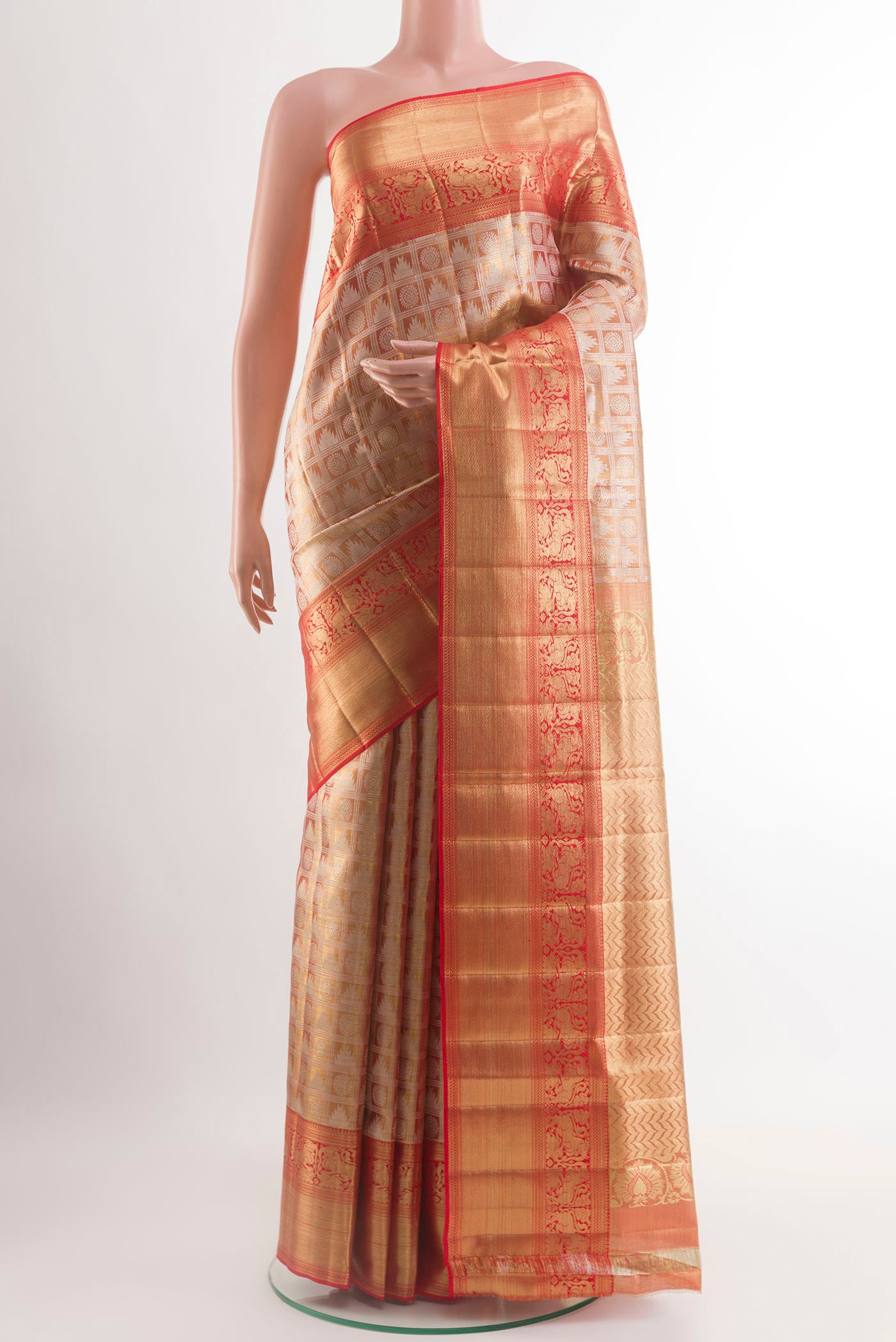 Gold Kanjivaram Tissue Silk Saree with Zari Brocade on the body and Zari Border.  displayed on a mannequin