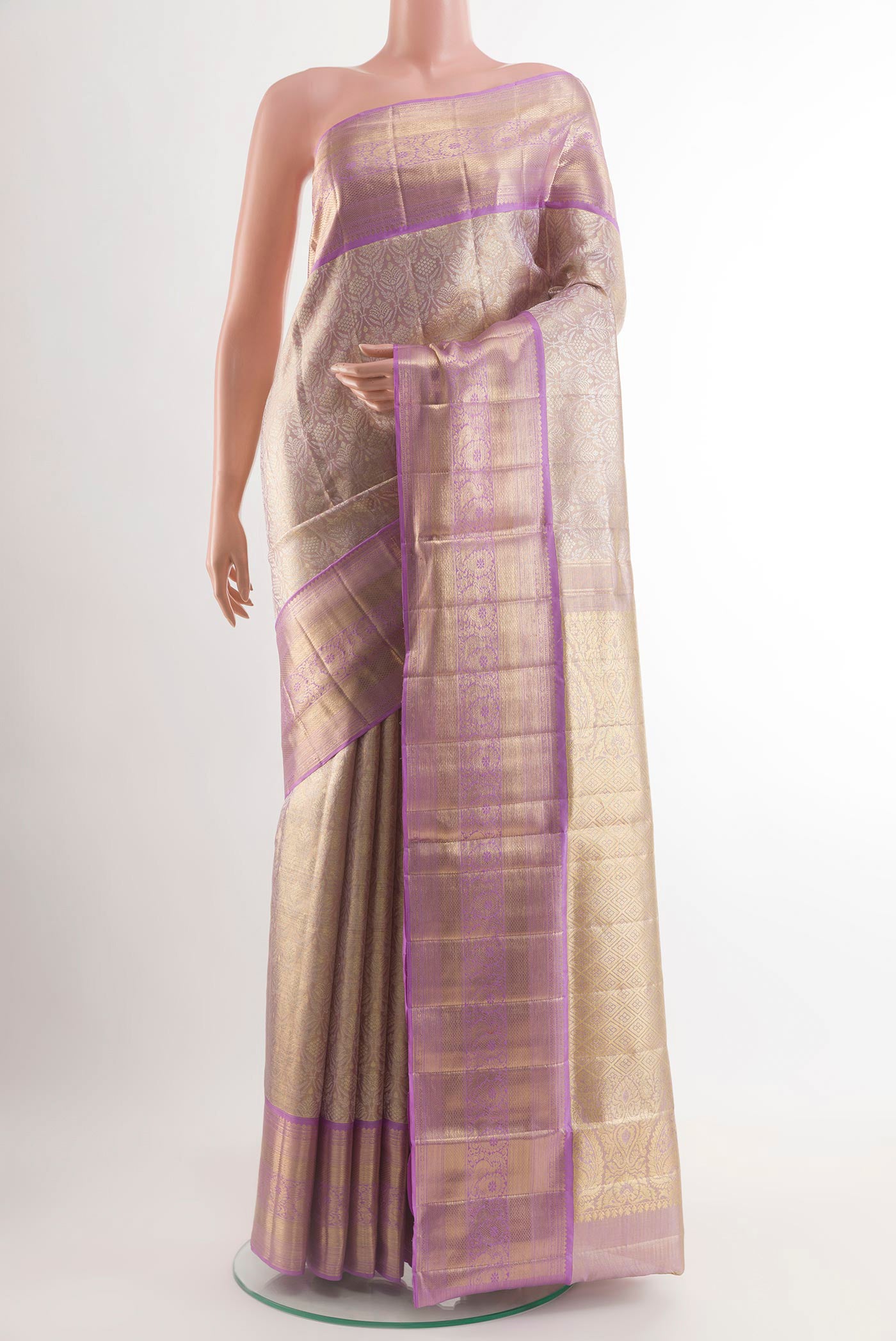 Lavender Kanjivaram Tissue Silk Saree with Zari Brocade on the body and Zari Border.  displayed on a mannequin