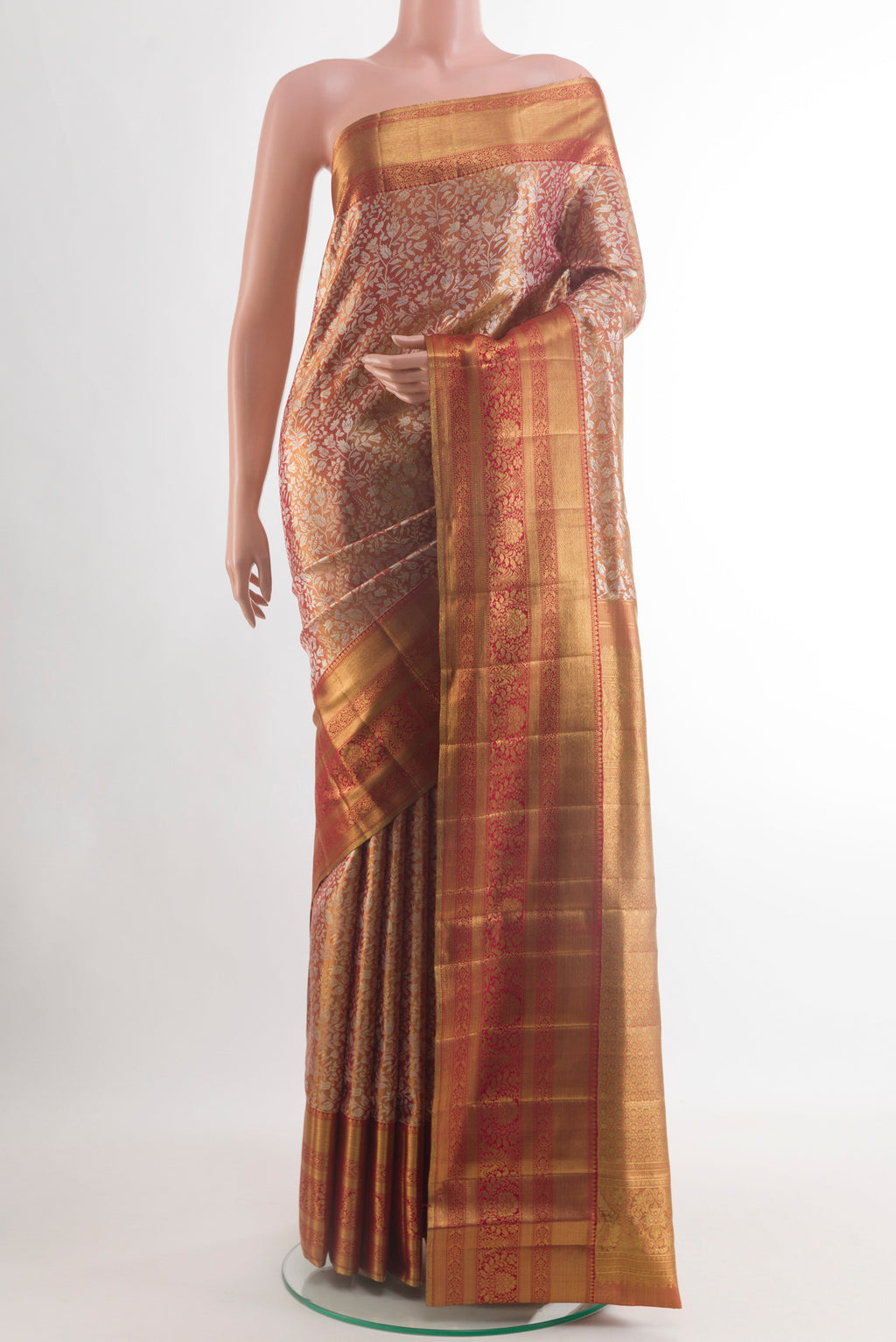 Golden Kanjivaram Tissue Silk Saree with Zari Brocade on the body and Zari Border.  displayed on a mannequin