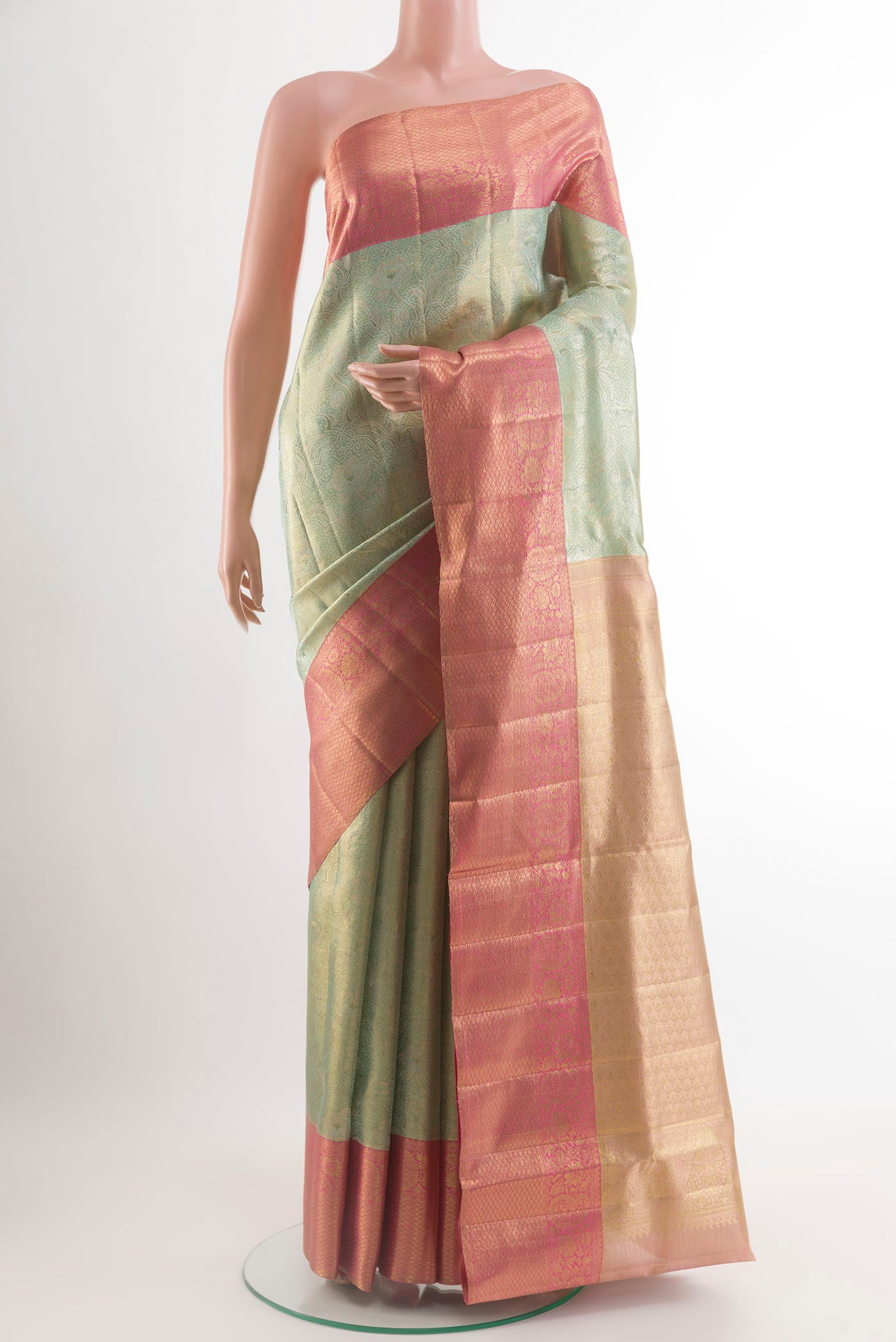 Sea Green Kanjivaram Tissue Silk Saree with Zari Brocade on the body and Zari Border.  displayed on a mannequin