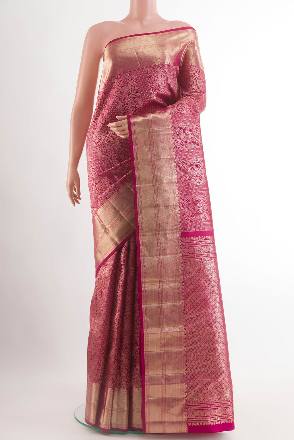 Magenta Kanchipuram Silk Saree with Zari Brocade on the body and Zari Border.  displayed on a mannequin
