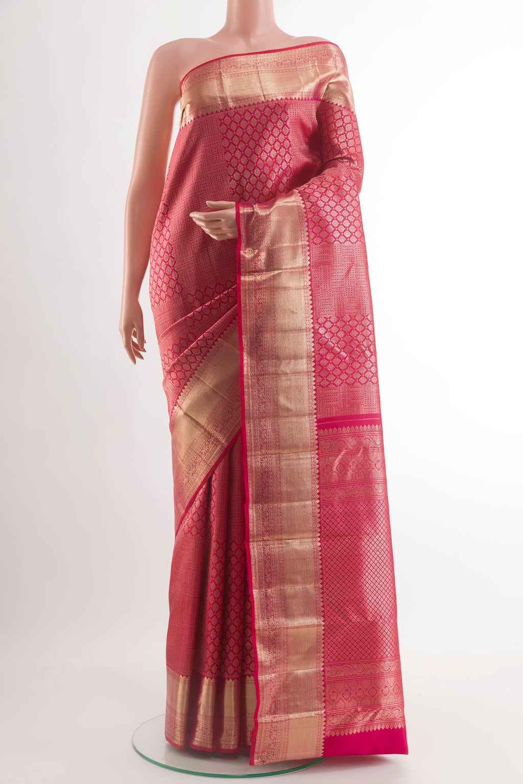 Red Kanchipuram Silk Saree with Zari Brocade on the body and Zari Border.  displayed on a mannequin