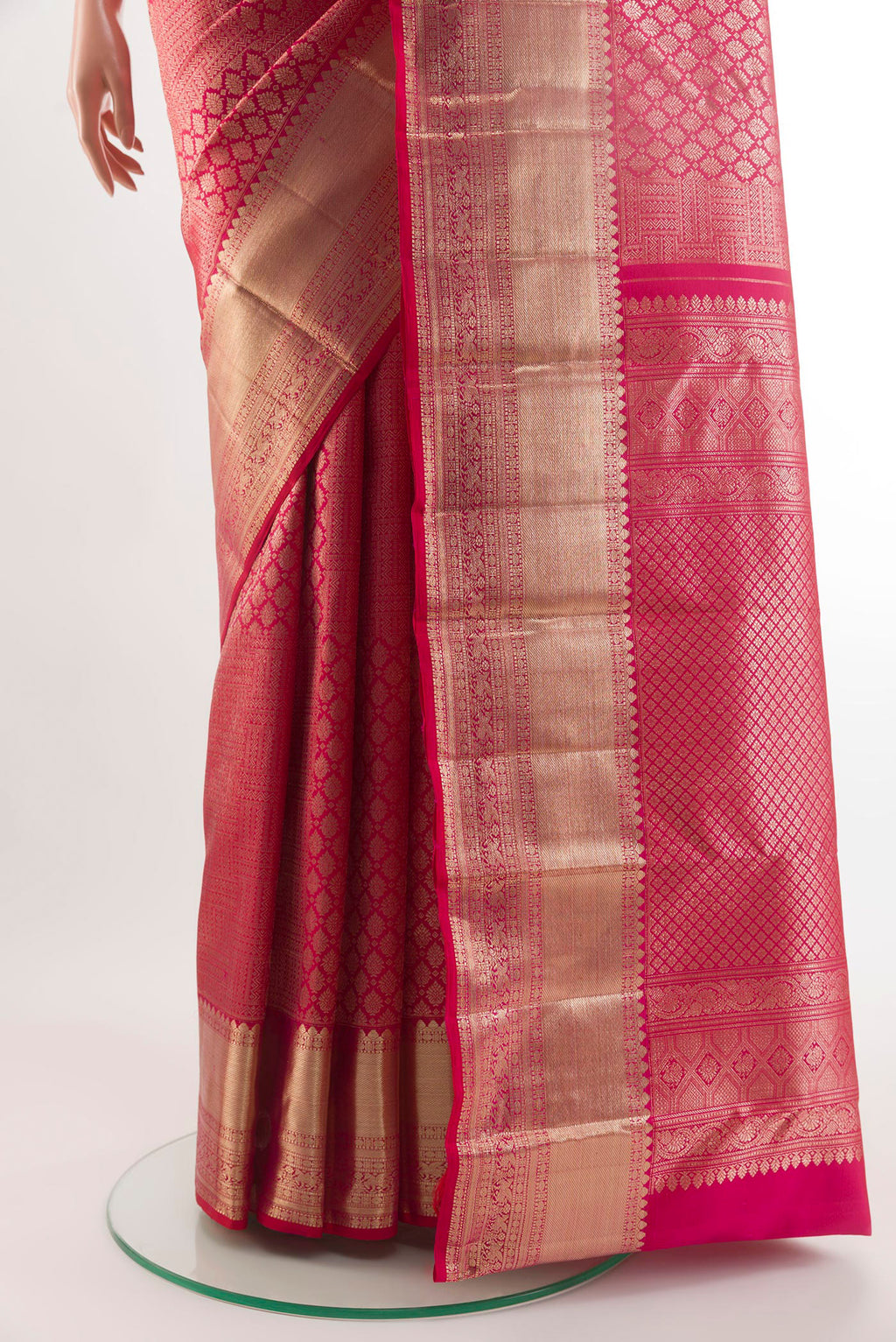 Pleats and pallu of Red Kanchipuram Silk Saree with Zari Brocade on the body and Zari Border. 