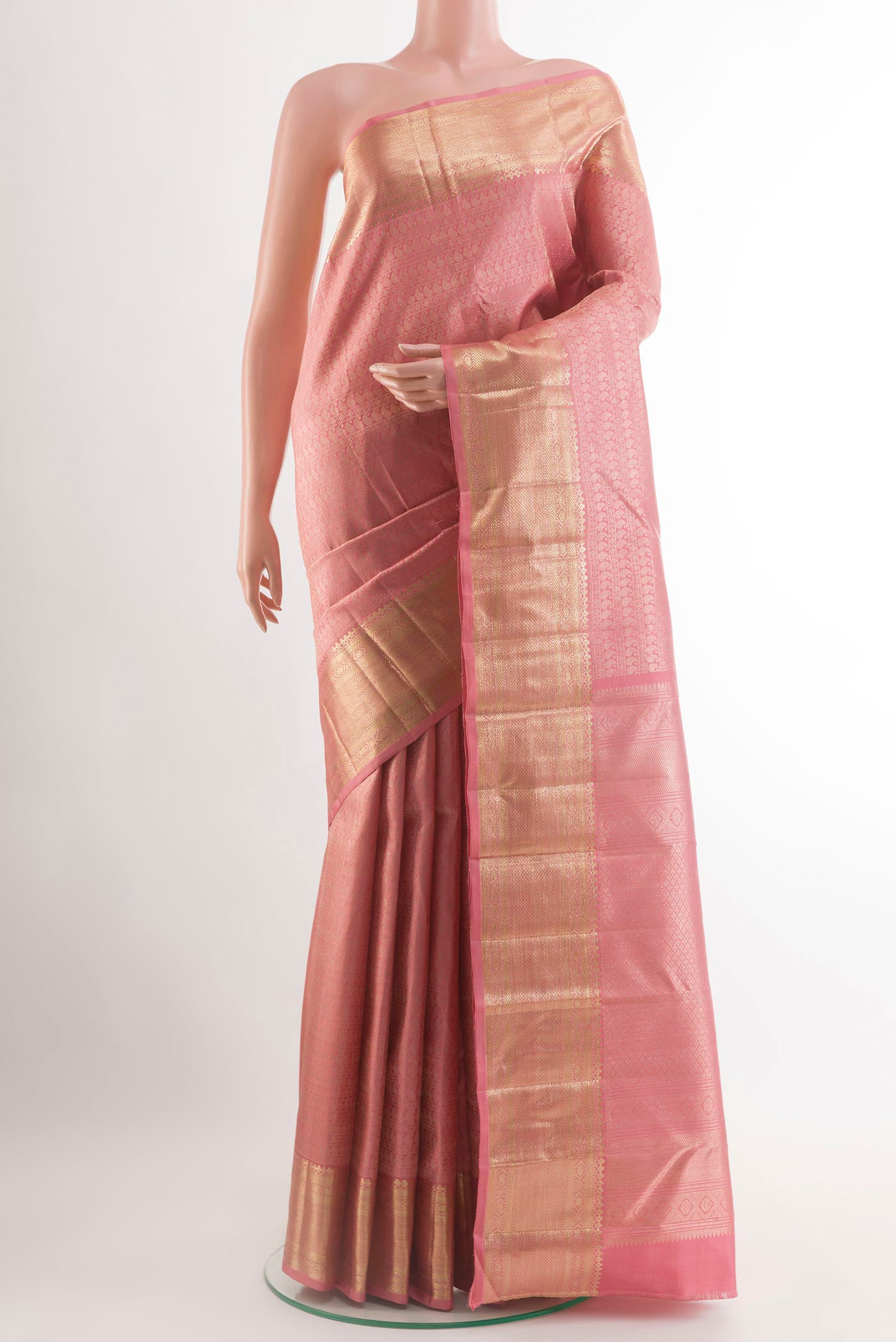 Rose pink Kanchipuram Silk Saree with Zari Brocade on the body and Zari Border.  displayed on a mannequin