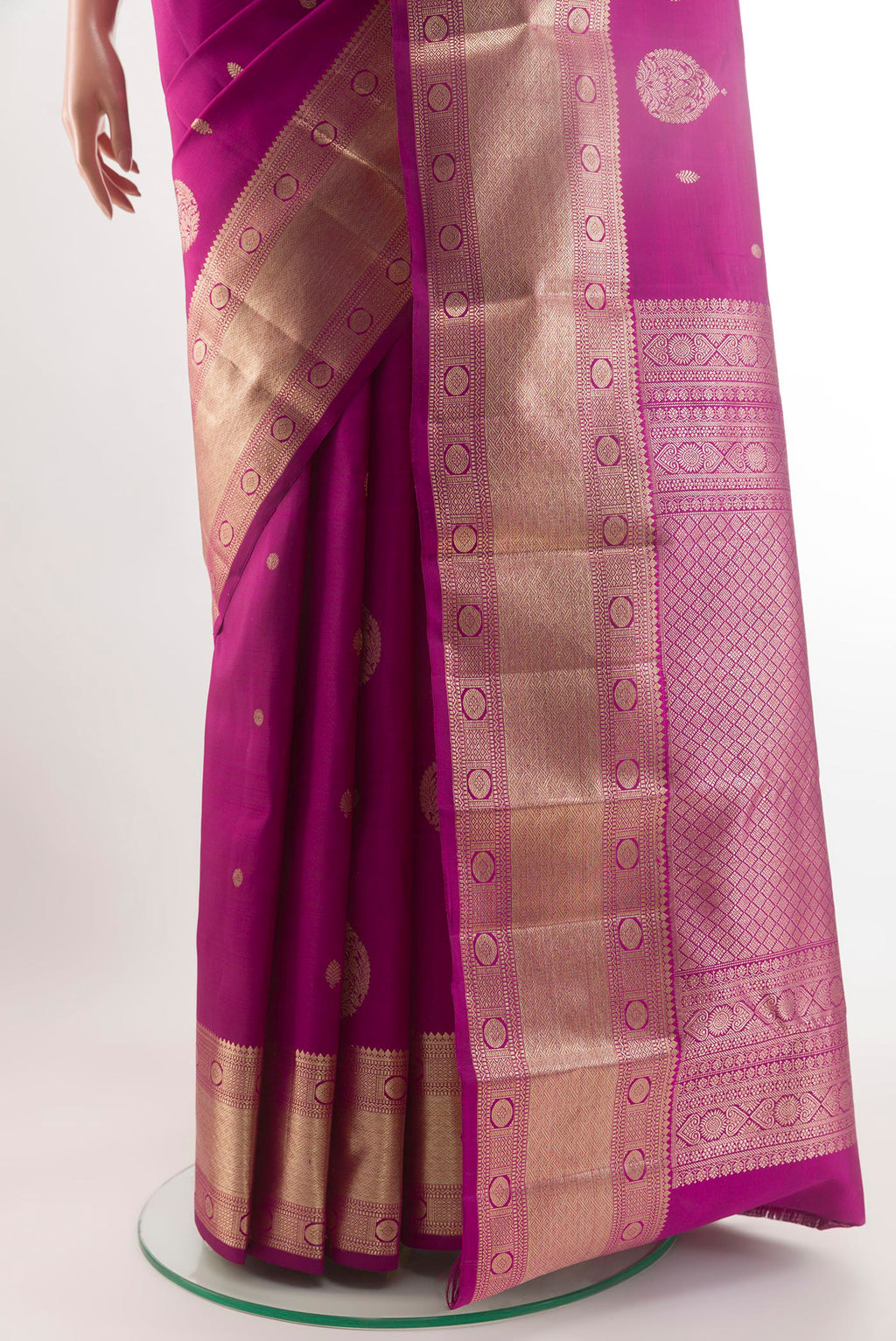 Pleats and pallu of Magenta Kanjivaram Silk Saree with Zari Butta on the body and Zari Border. 