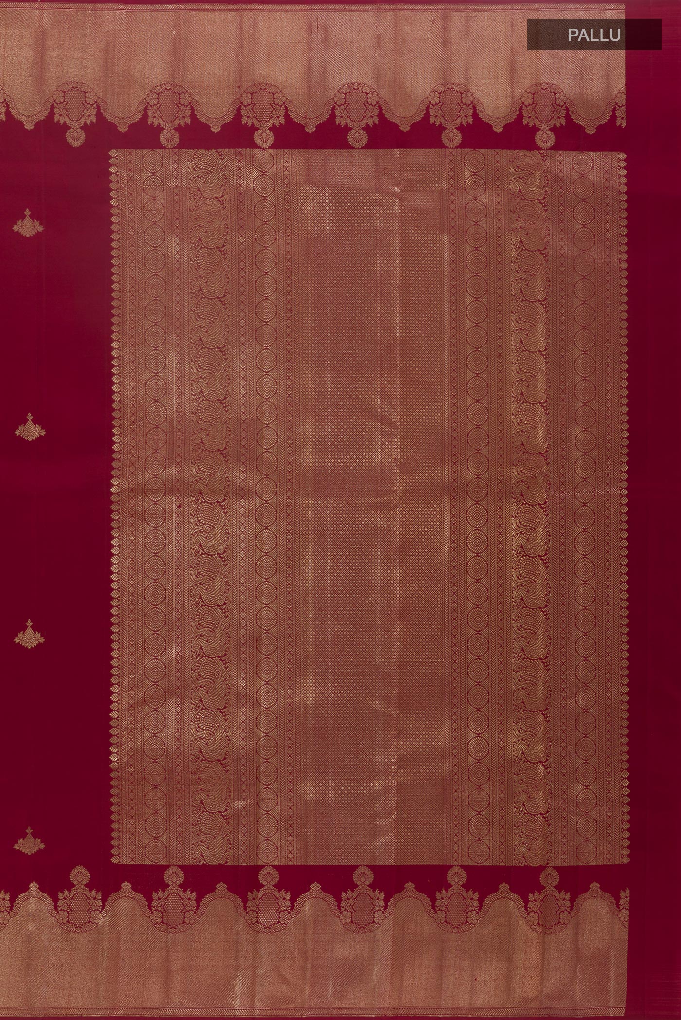 Close up image of the pallu of Maroon Kanjivaram Silk Saree with Zari Butta on the body and Zari Border. 