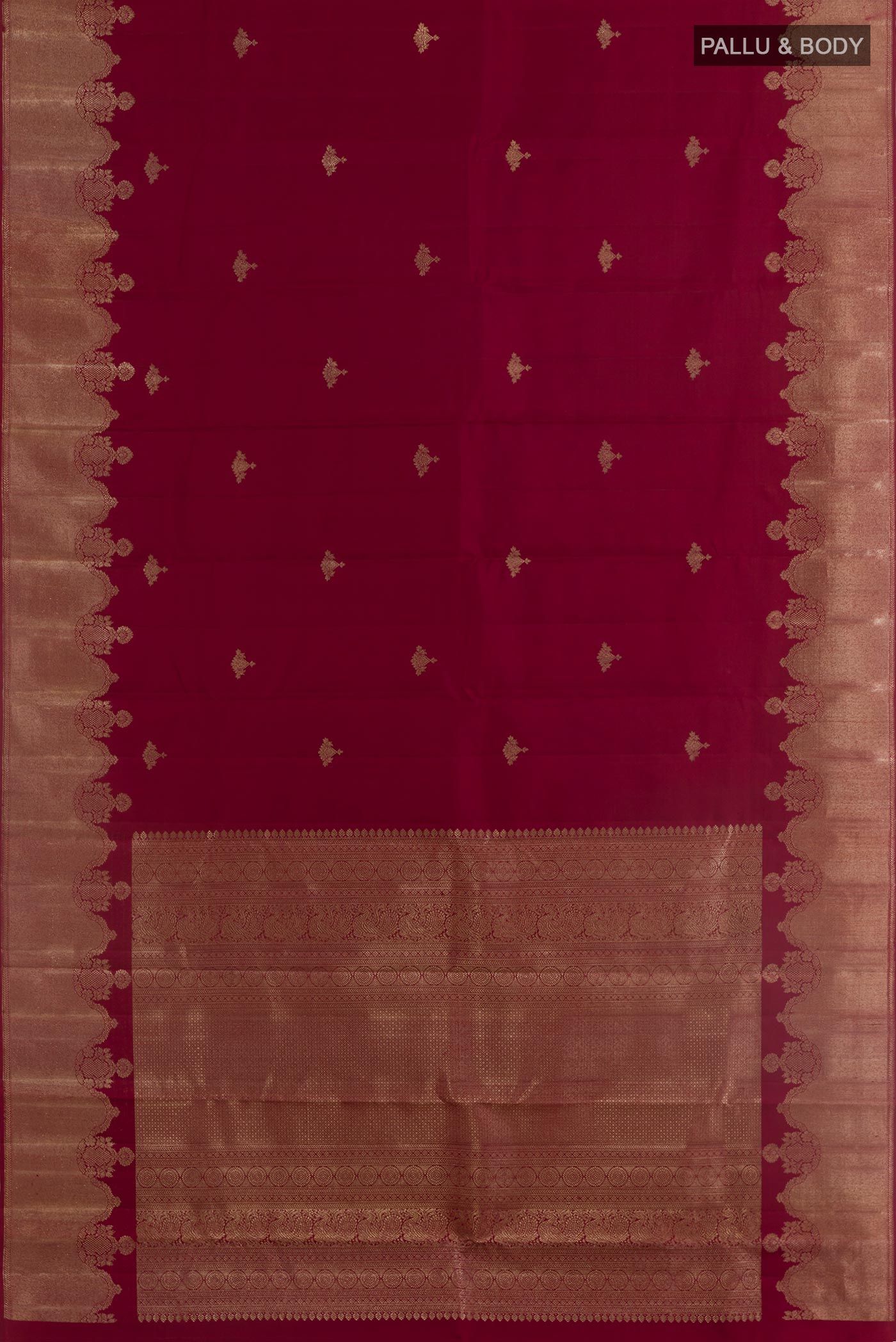 Flat view of Maroon Kanjivaram Silk Saree with Zari Butta on the body and Zari Border. 