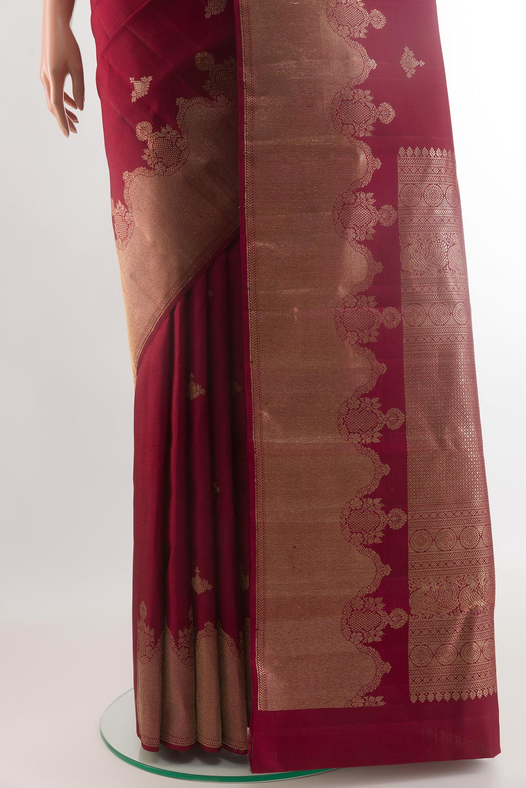 Pleats and pallu of Maroon Kanjivaram Silk Saree with Zari Butta on the body and Zari Border. 