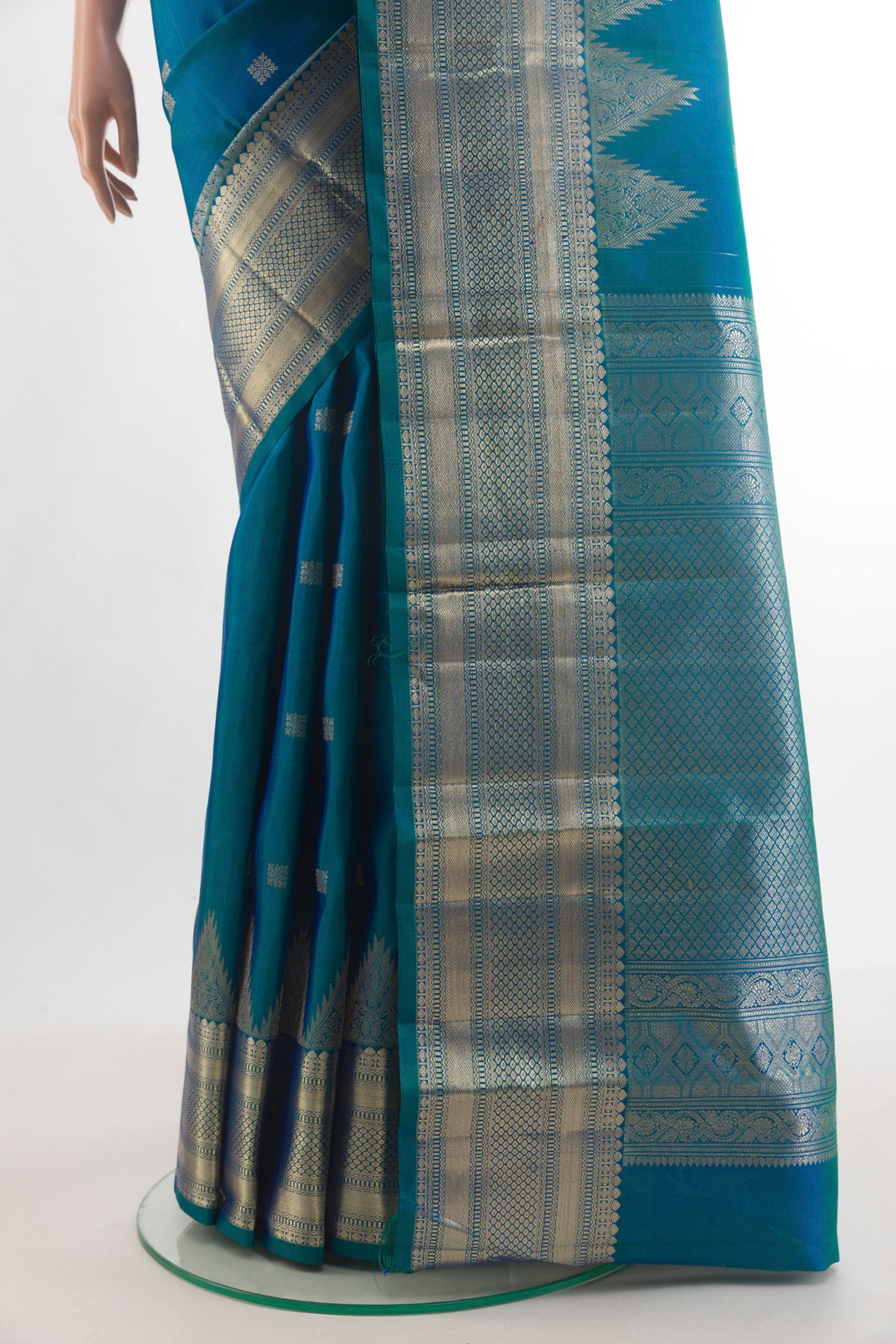 Pleats and pallu of Pure Silk Peacock Blue Kanjivaram Saree with Zari Butta on the body and Zari Border. 