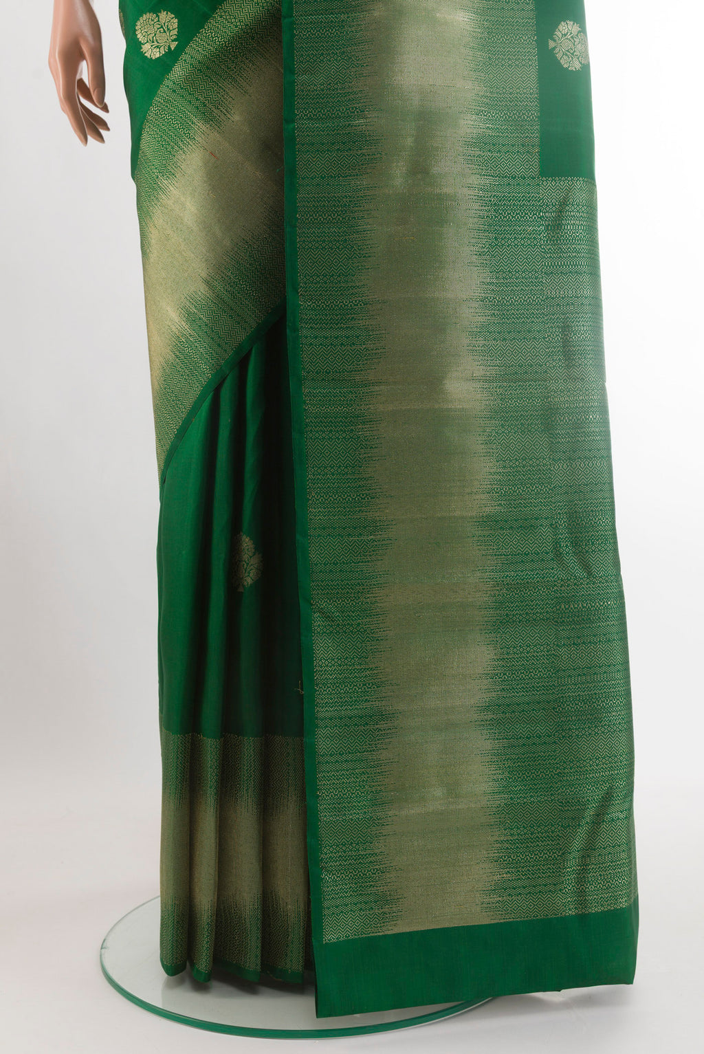 Pleats and pallu of Green Kanjivaram Silk Saree with Zari Butta on the body and Zari Border. 
