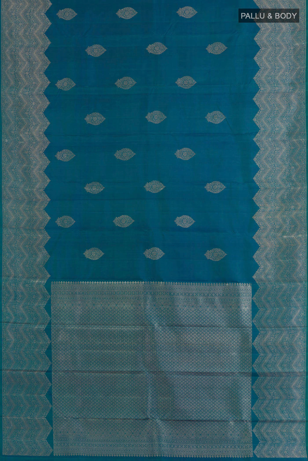 Flat view of Peacock Blue Kanjivaram Silk Saree with Zari Butta on the body and Zari Border. 