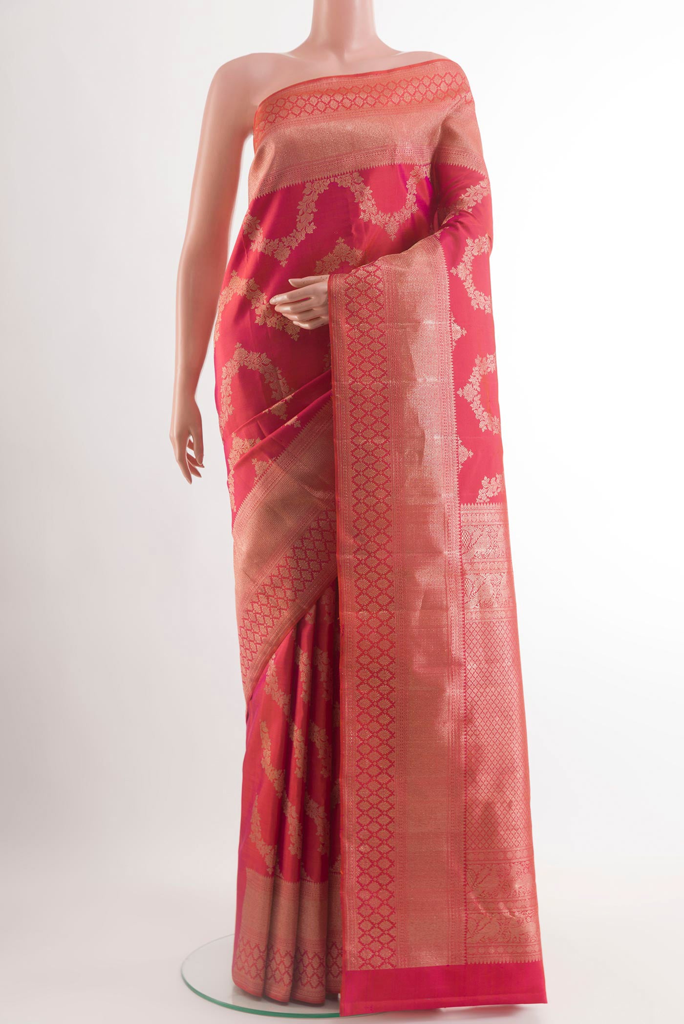 Pink Kanchipuram Silk Saree with Zari Brocade on the body and Zari Border.  displayed on a mannequin