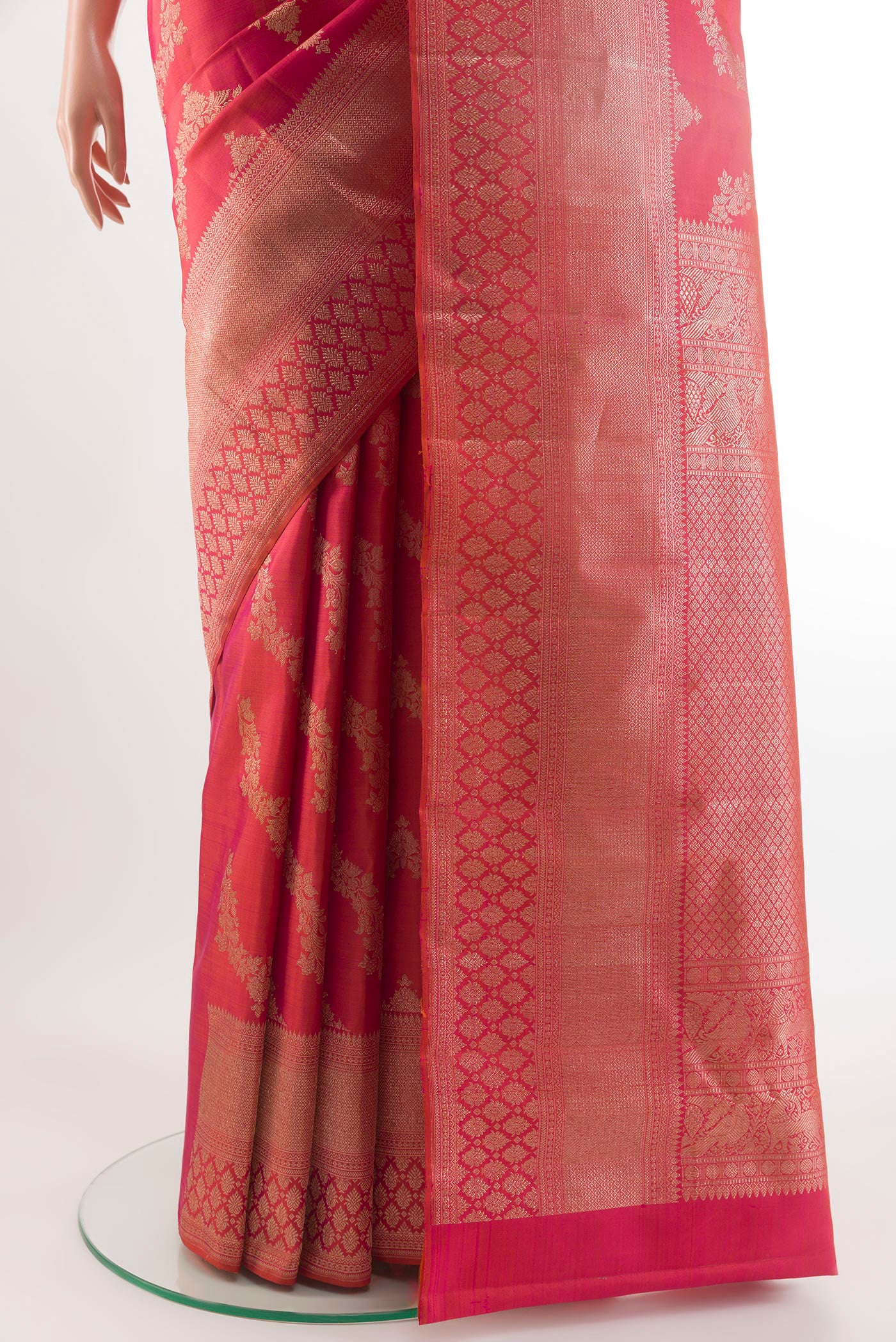Pleats and pallu of Pink Kanchipuram Silk Saree with Zari Brocade on the body and Zari Border. 