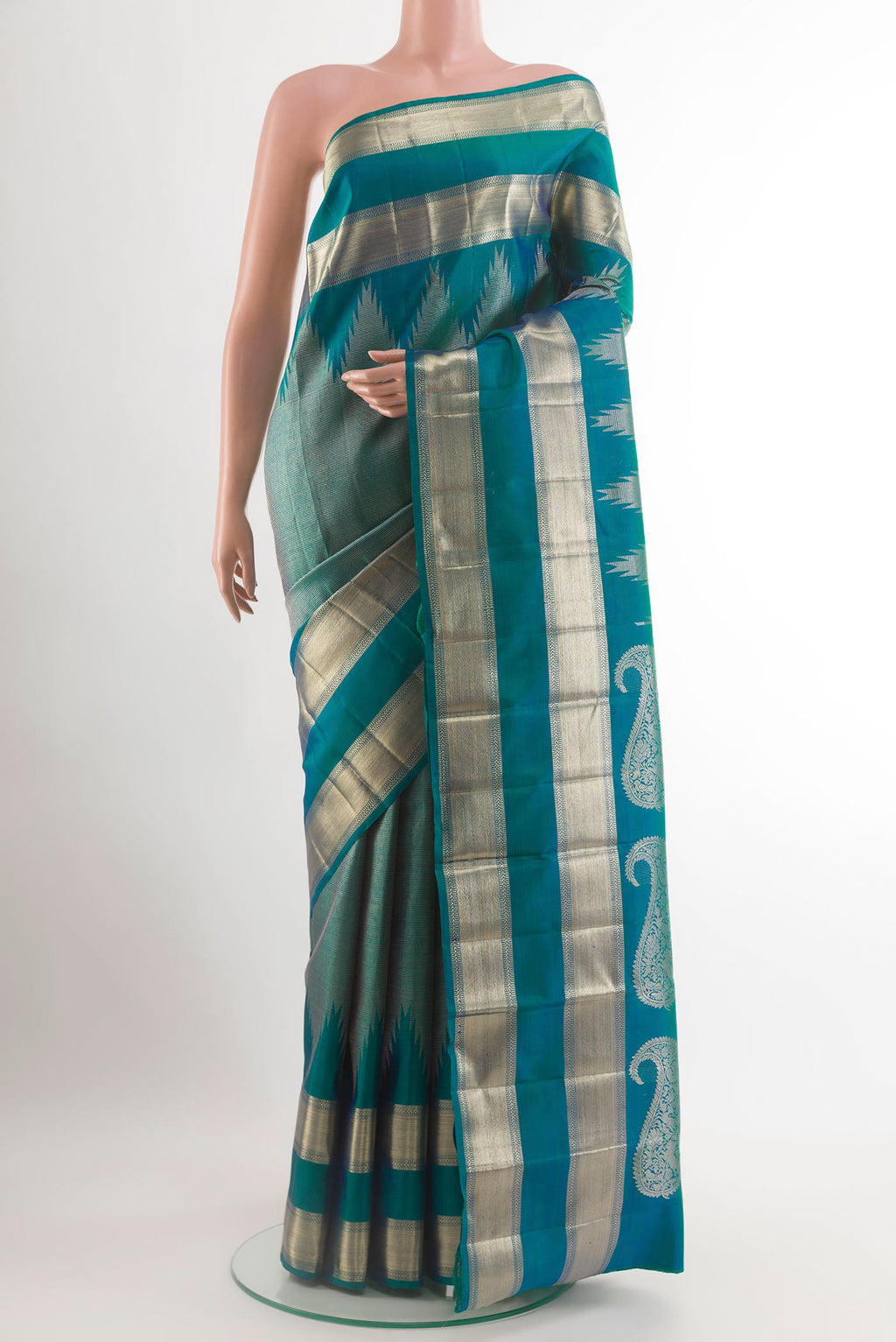 Peacock Blue Kanchipuram Silk Saree with Zari Brocade on the body and Zari Border.  displayed on a mannequin