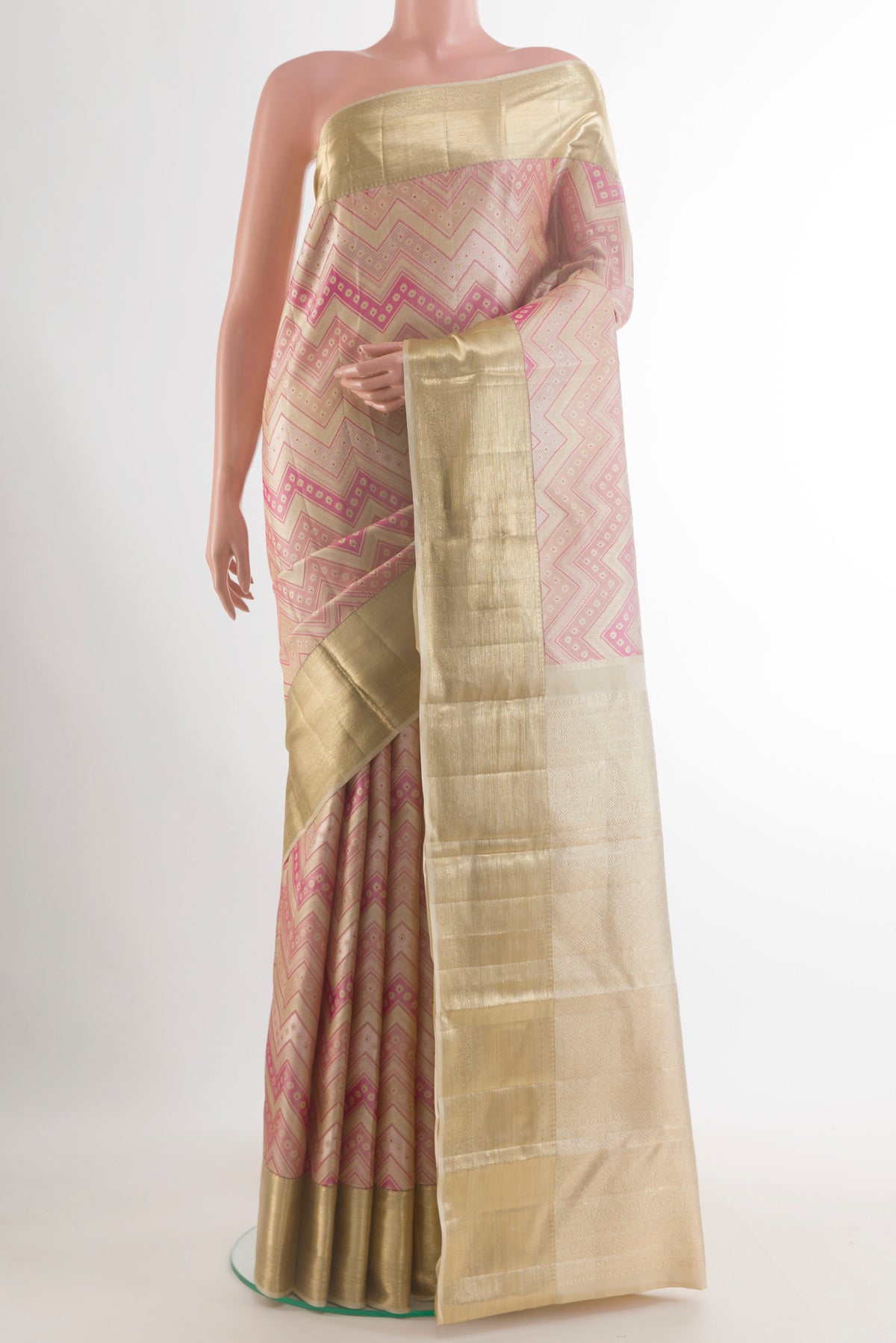 Pure Silk Beige Kanjivaram Saree with Zari Brocade on the body and Zari Border.  displayed on a mannequin
