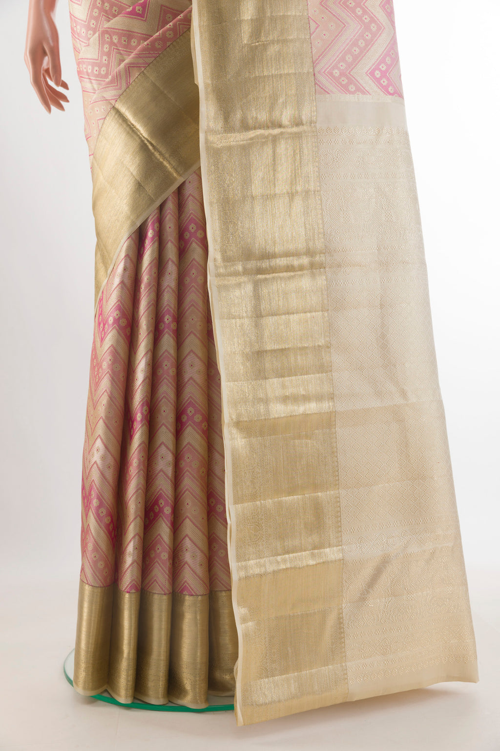 Pleats and pallu of Pure Silk Beige Kanjivaram Saree with Zari Brocade on the body and Zari Border. 