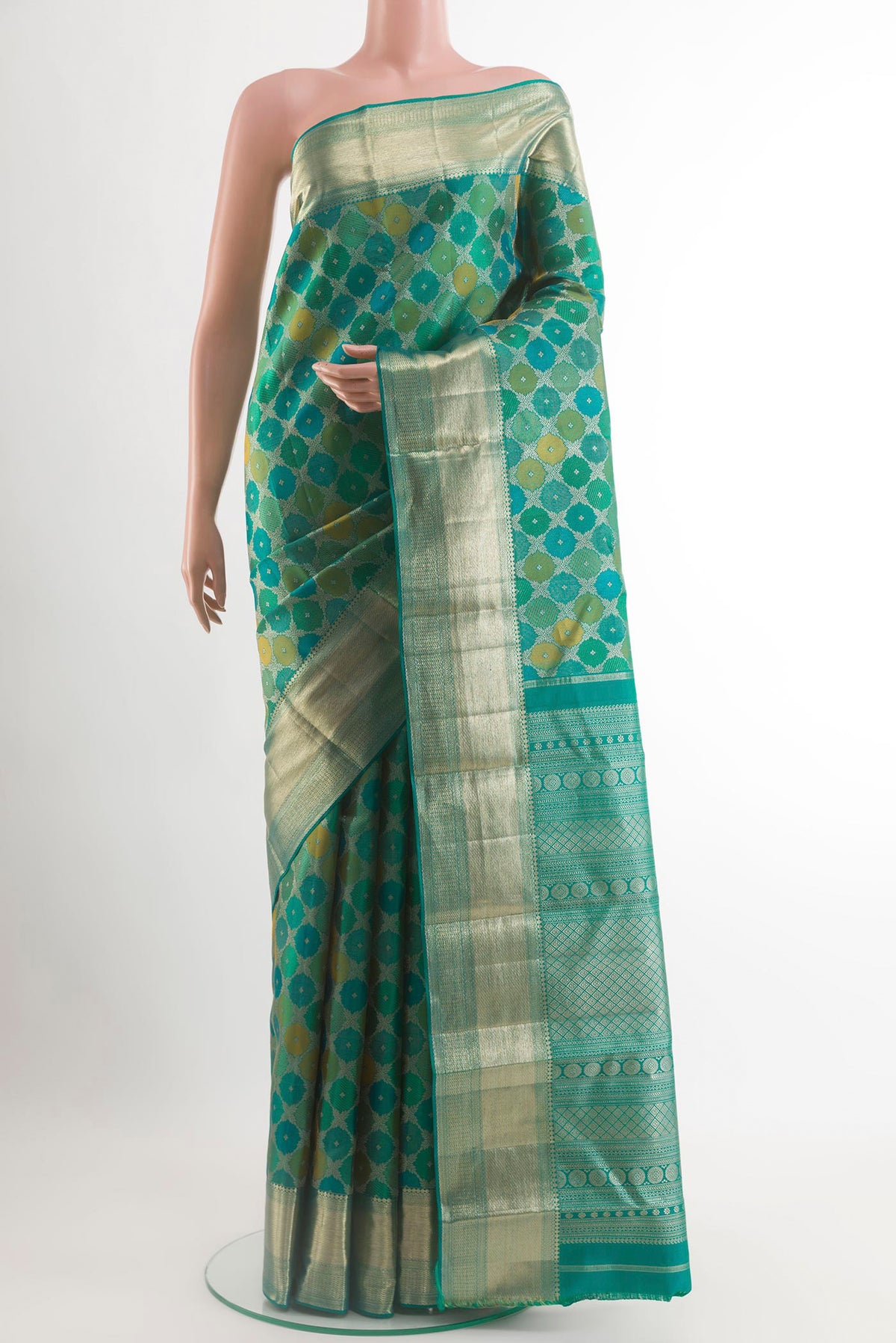 Sea Green Kanjivaram Silk Saree with Zari Brocade on the body and Zari Border.  displayed on a mannequin