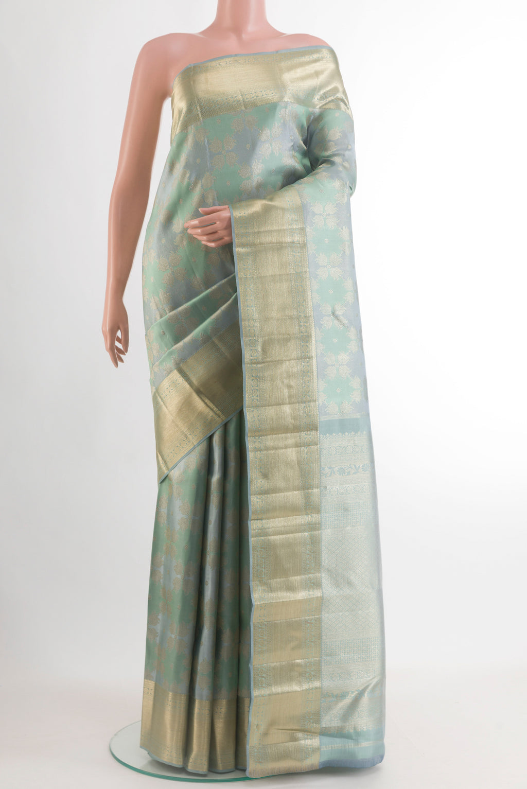 Grey Kanjivaram Tissue Silk Saree with Zari Brocade on the body and Zari Border.  displayed on a mannequin