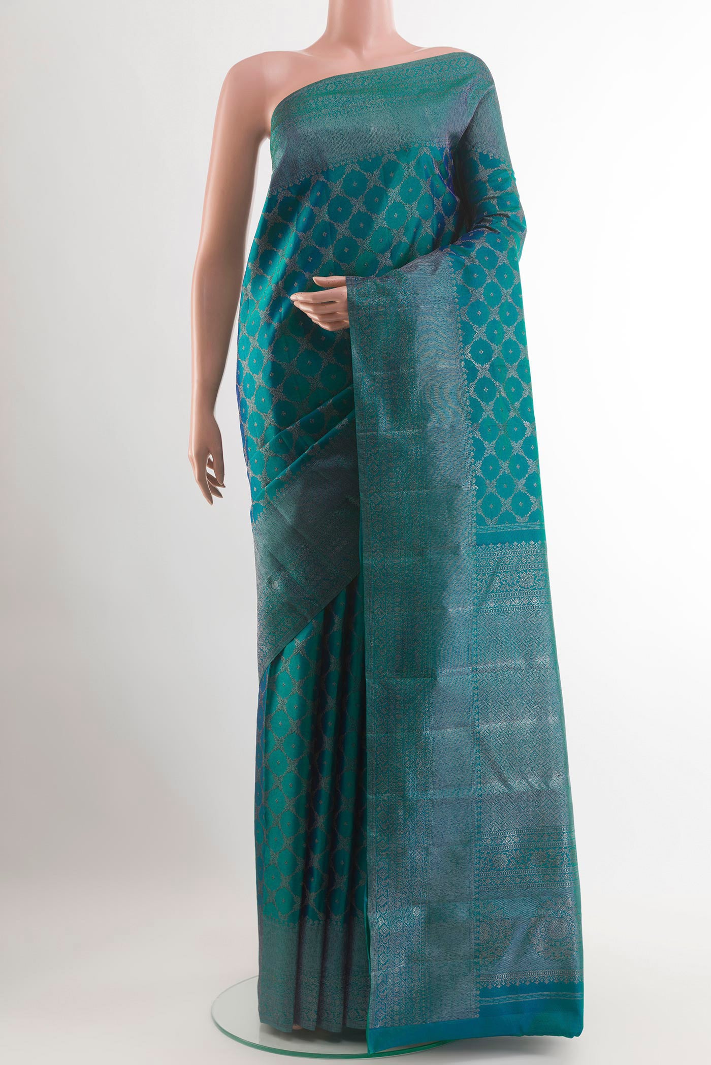 Peacock Blue Kanjivaram Silk Saree with Zari Brocade on the body and Zari Border.  displayed on a mannequin