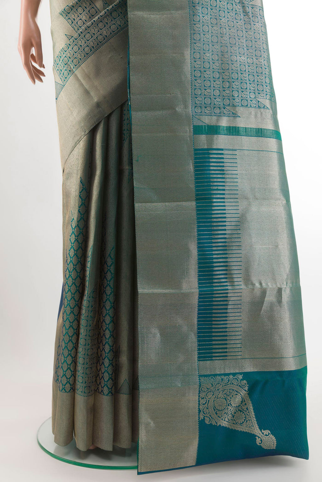 Pleats and pallu of Peacock Blue Dual Tone Kanchipuram Silk Saree with Zari Brocade on the body and Zari Border. 