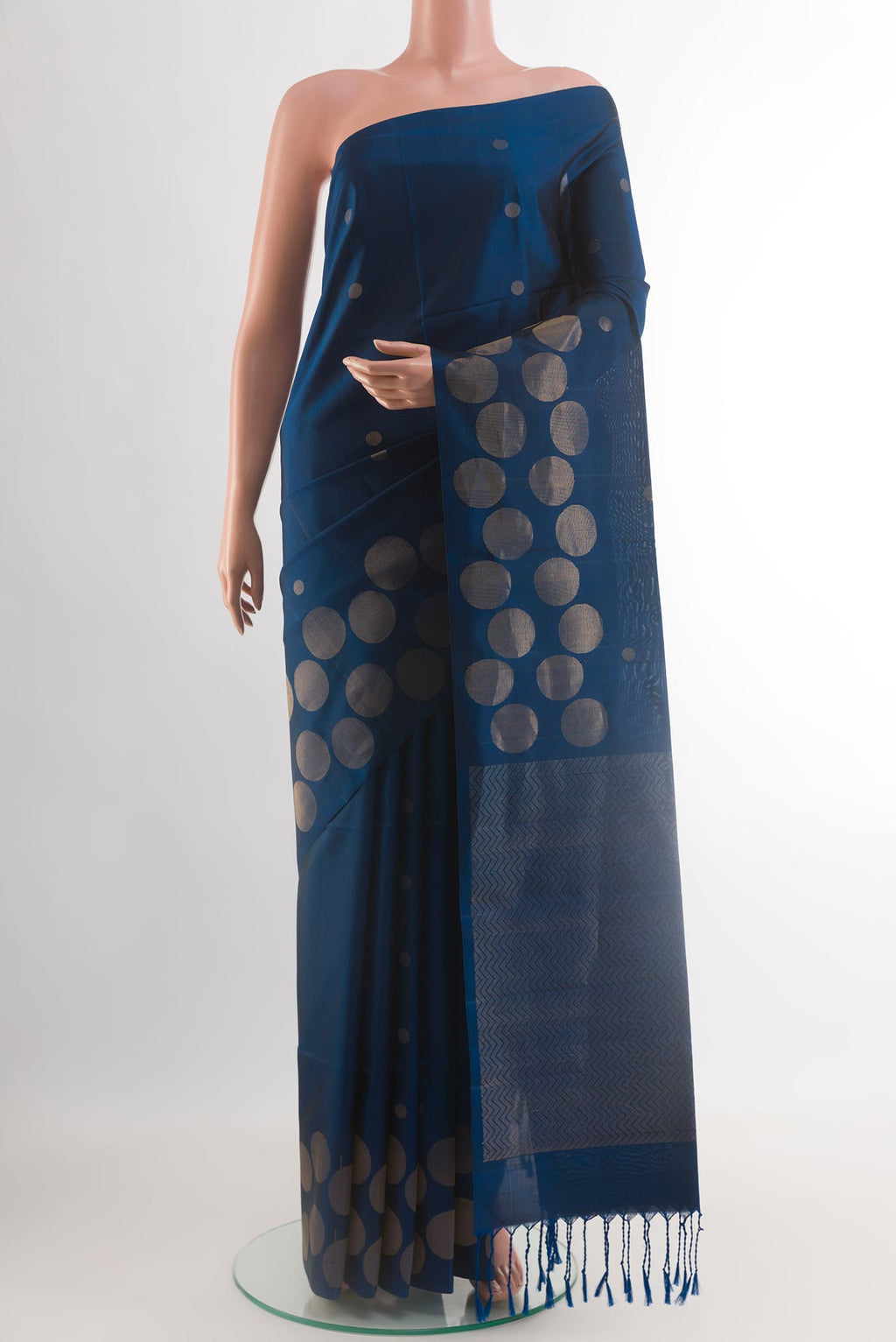 Blue Soft Silk Saree with Zari Butta on the body and Zari Border.  displayed on a mannequin
