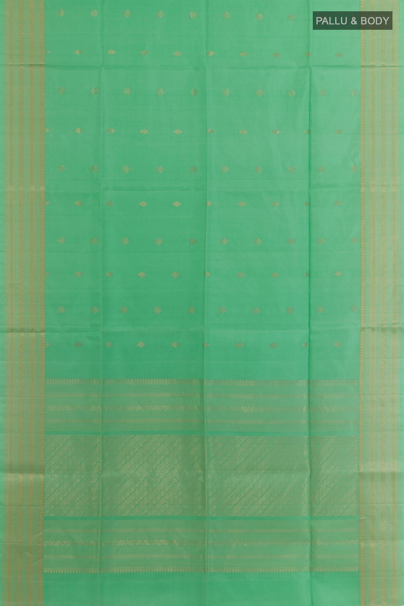 Flat view of Sea Green Soft Silk Saree with Zari Butta on the body and Zari Border. 
