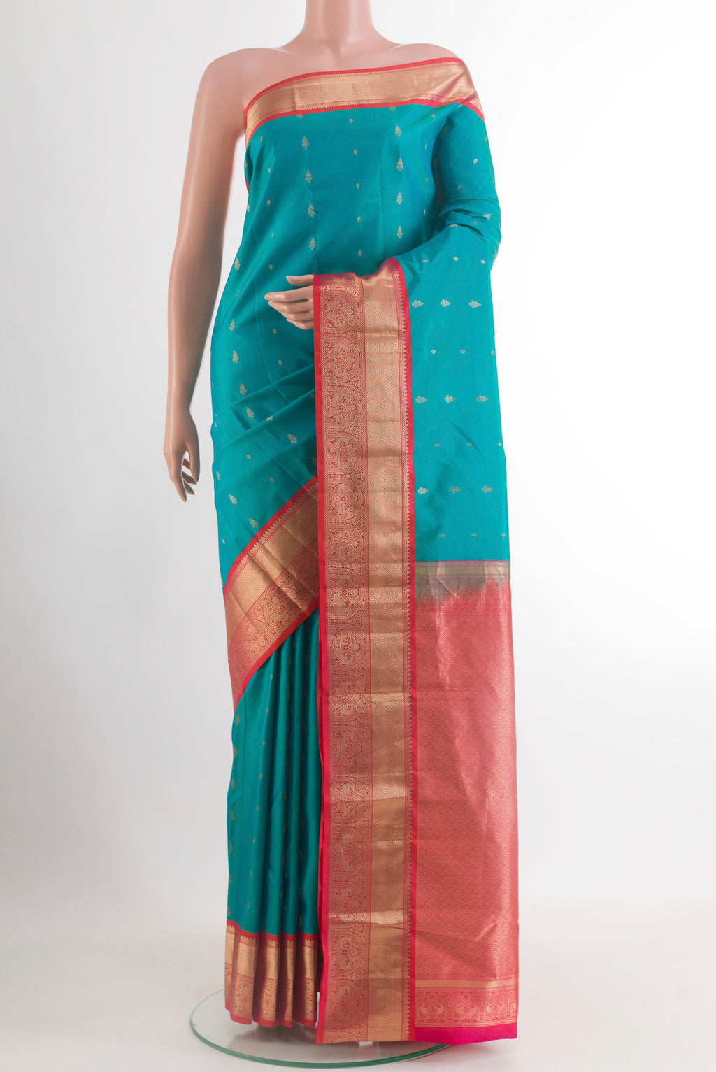 Blue Kanjivaram Silk Saree with Zari Butta on the body and Zari Border.  displayed on a mannequin