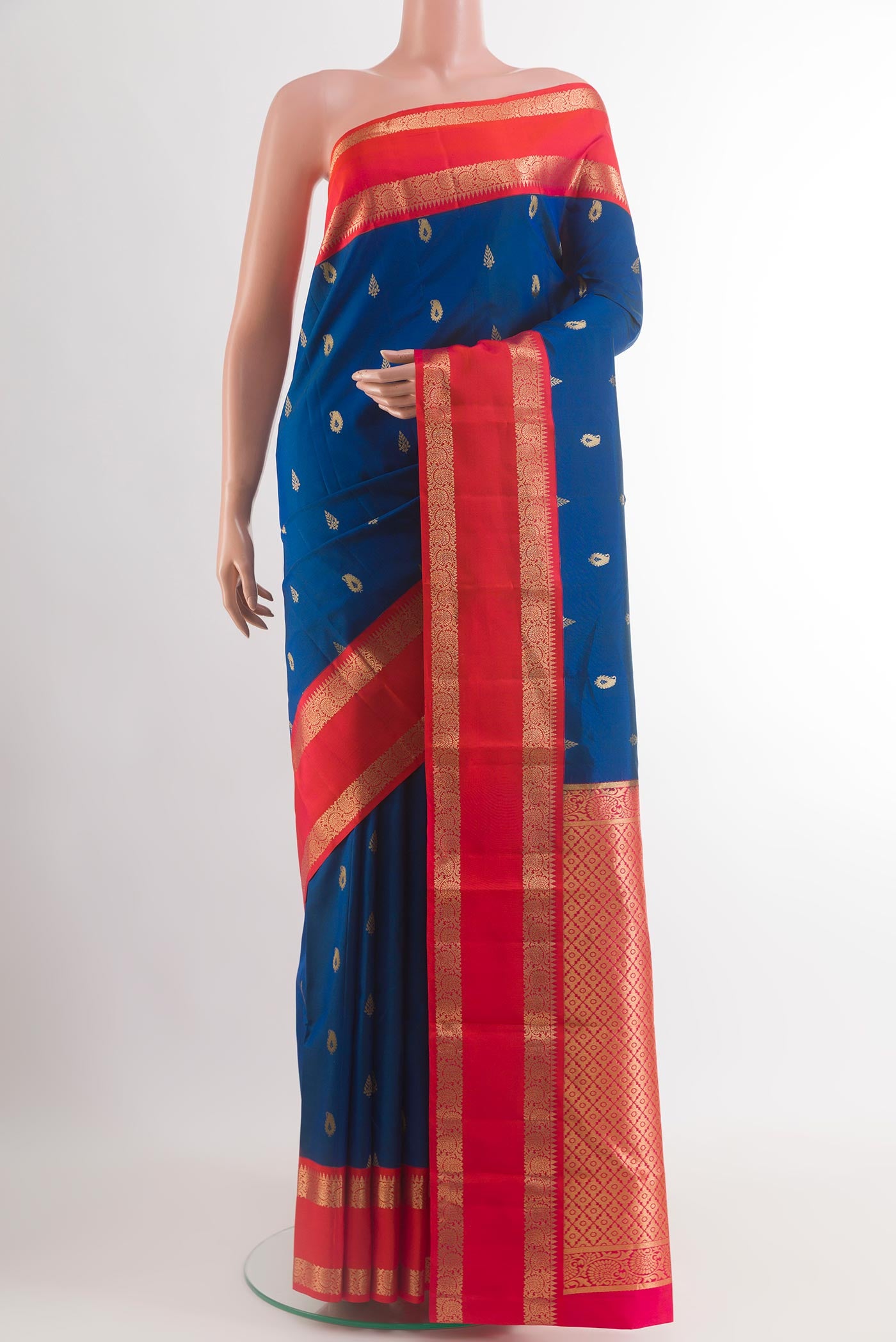 Blue Kanjivaram Silk Saree with Zari Butta on the body and Zari Border.  displayed on a mannequin