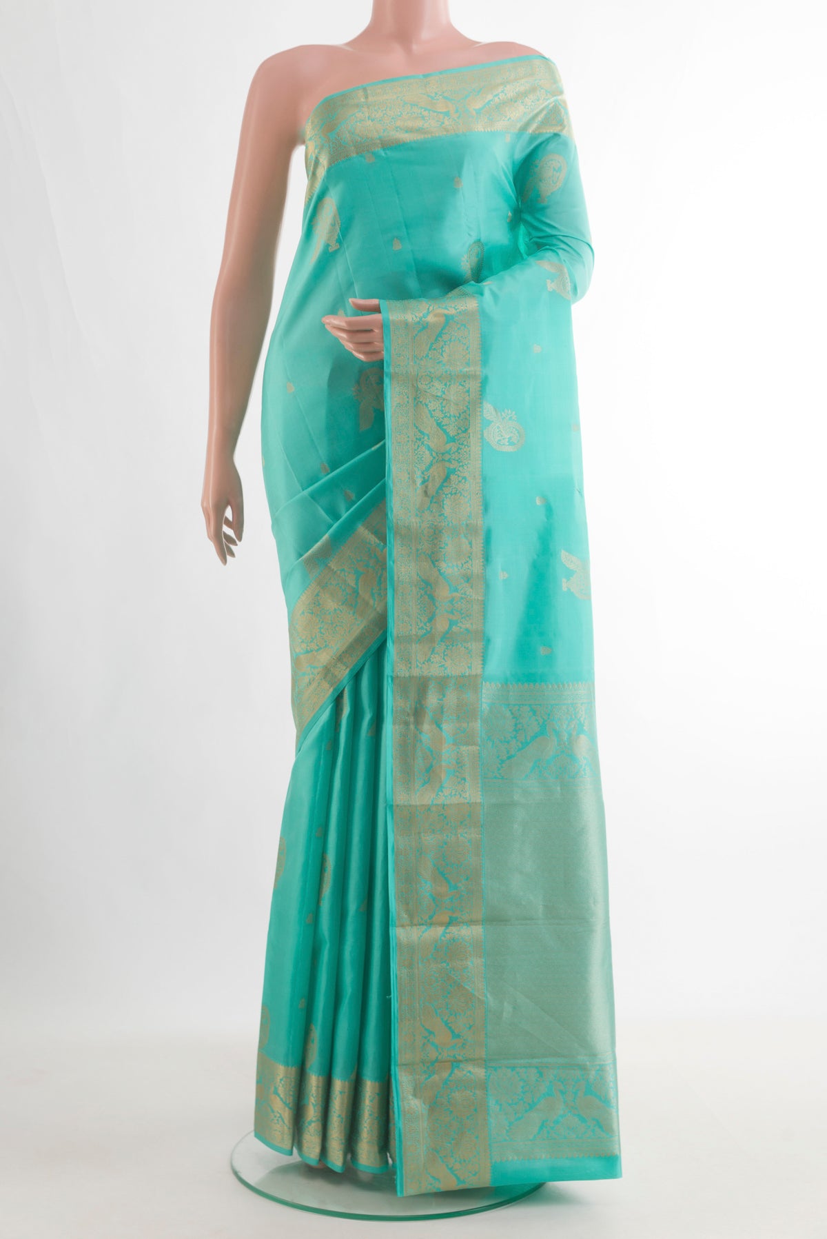 Pure Silk Turquoise Kanjivaram Saree with Zari Butta on the body and Zari Border.  displayed on a mannequin