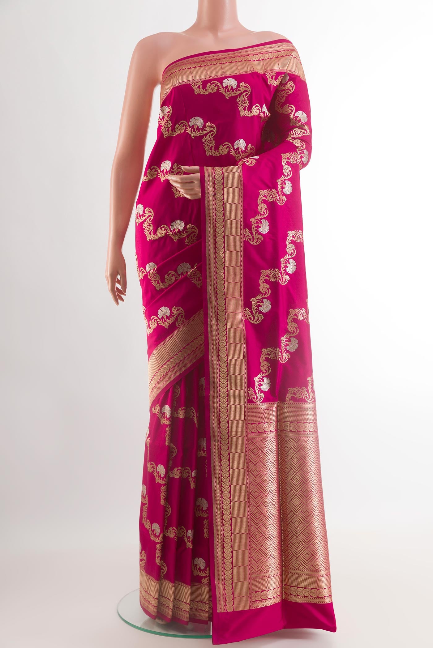 Magenta Banarasi Silk Saree with Zari Butta on the body and Zari Border.  displayed on a mannequin