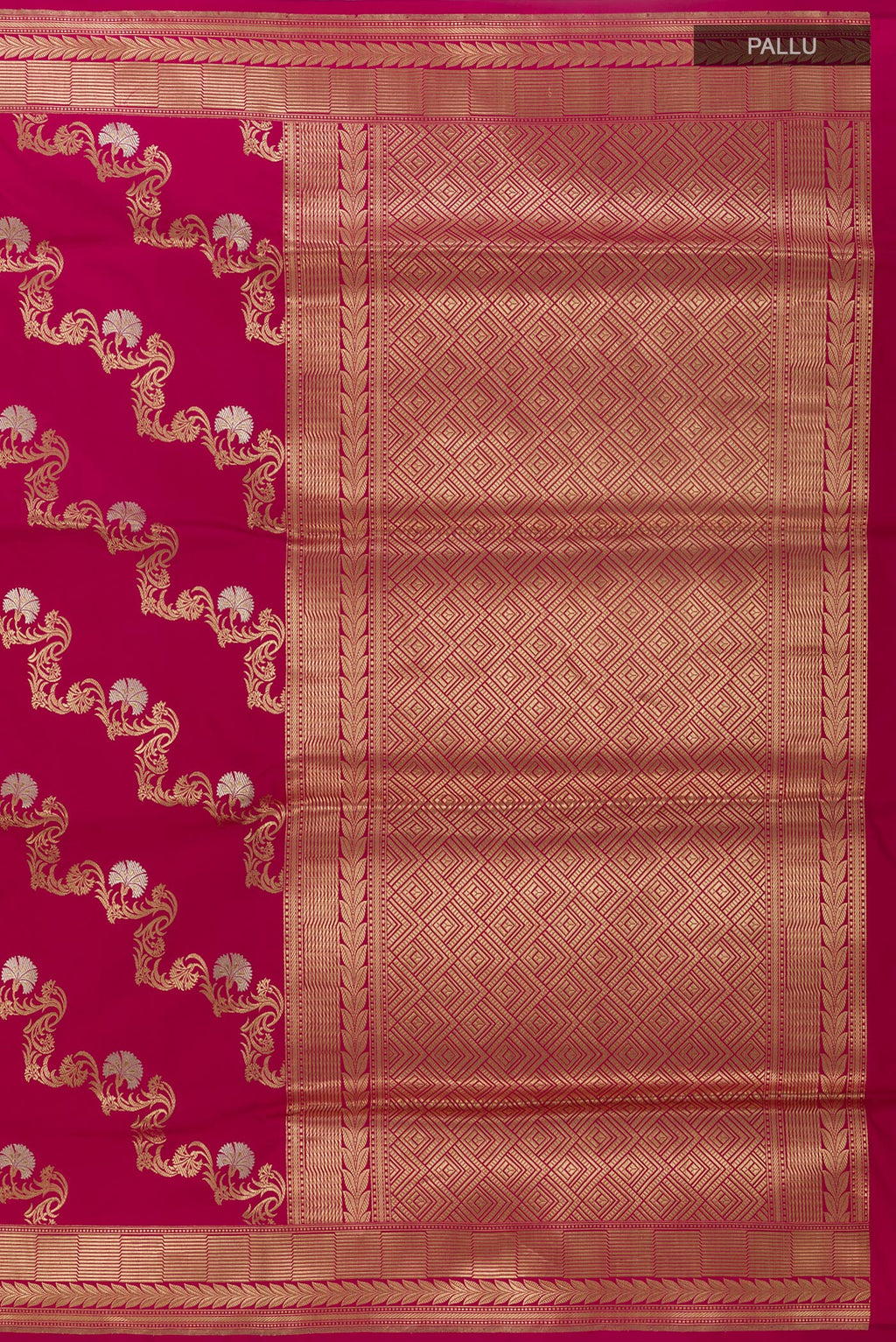 Close up image of the pallu of Magenta Banarasi Silk Saree with Zari Butta on the body and Zari Border. 