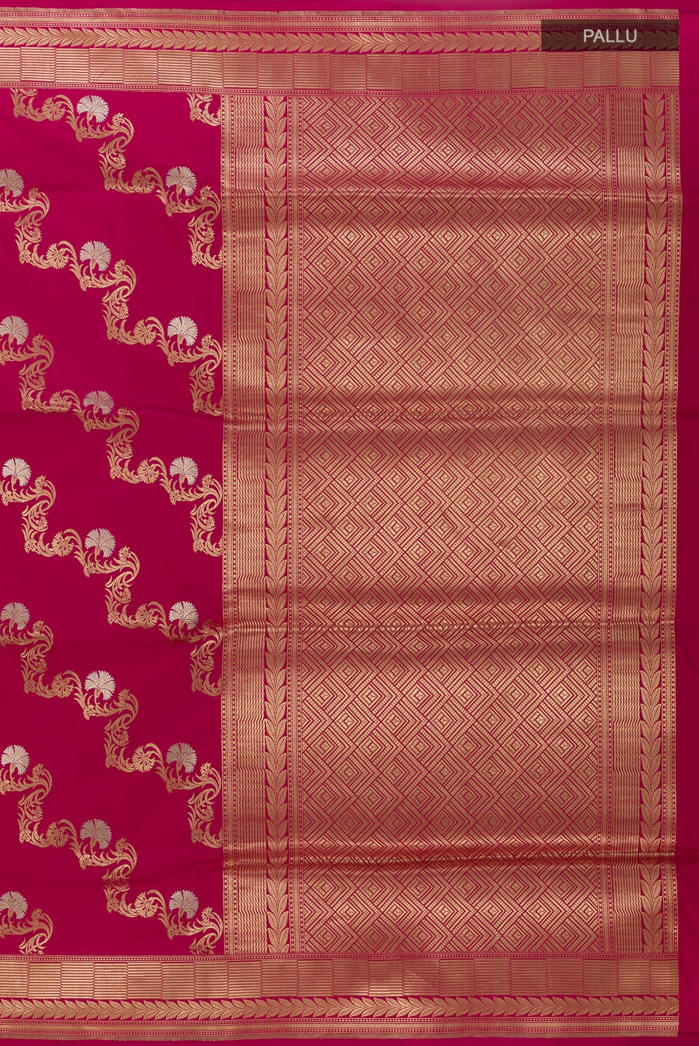 Close up image of the pallu of Magenta Banarasi Silk Saree with Zari Butta on the body and Zari Border. 