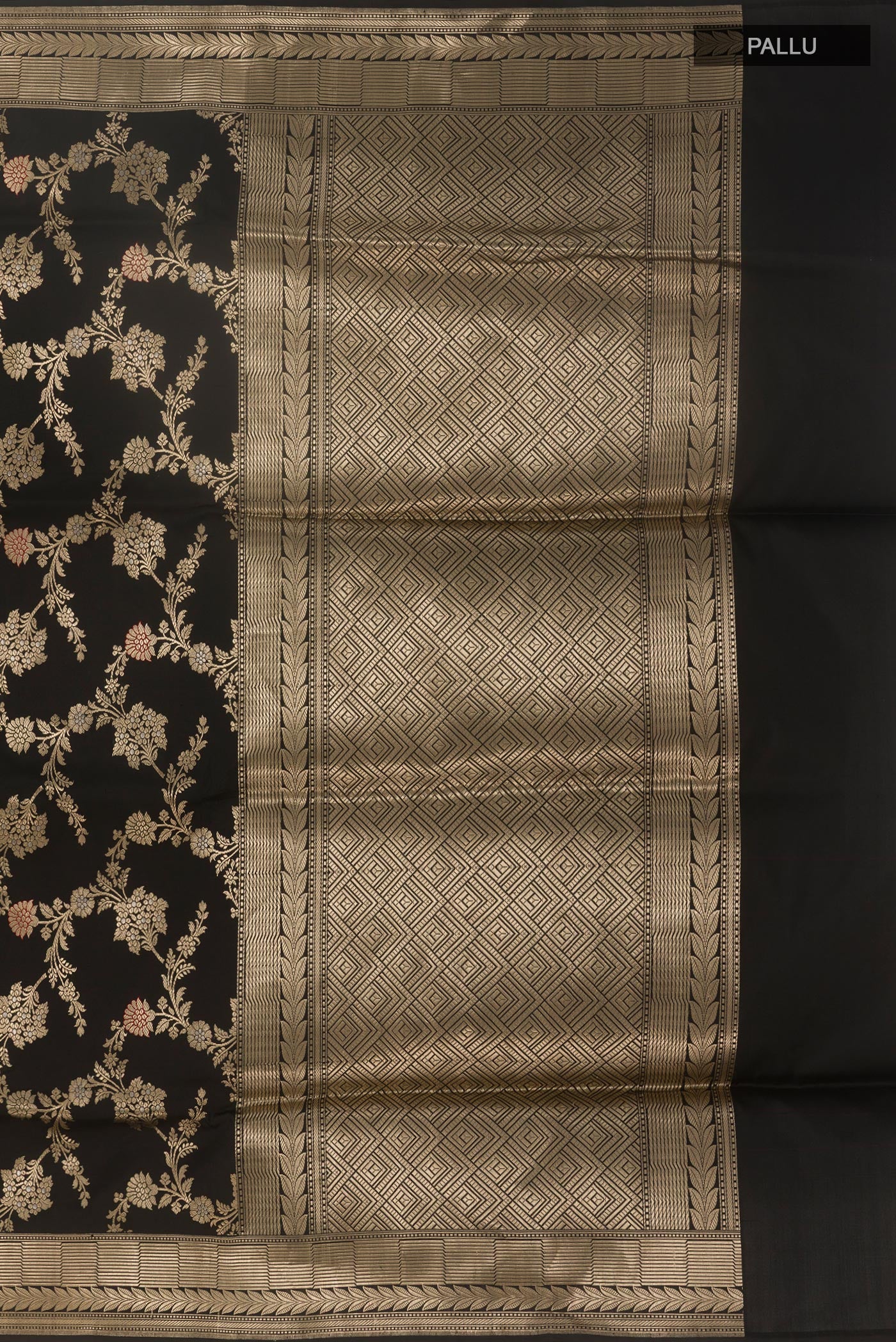 Close up image of the pallu of Black Banarasi Silk Saree with Zari Butta on the body and Zari Border. 