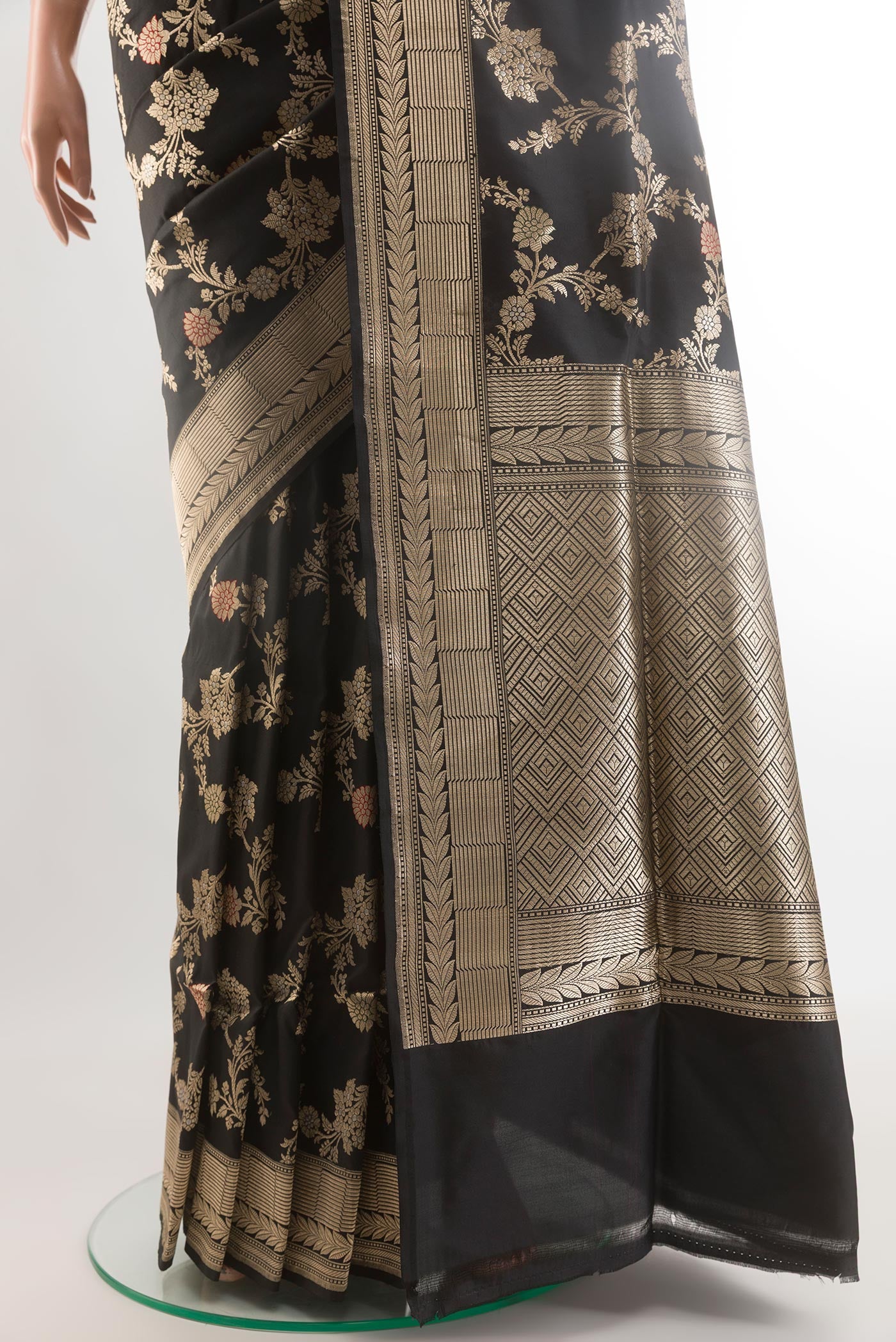 Pleats and pallu of Black Banarasi Silk Saree with Zari Butta on the body and Zari Border. 