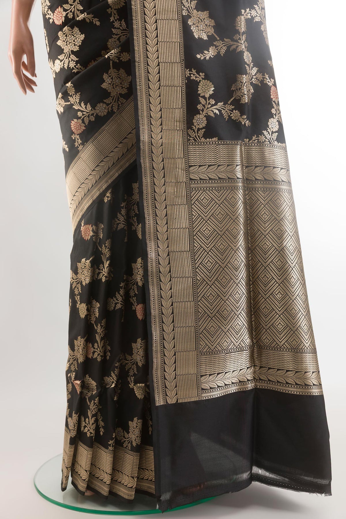 Pleats and pallu of Black Banarasi Silk Saree with Zari Butta on the body and Zari Border. 