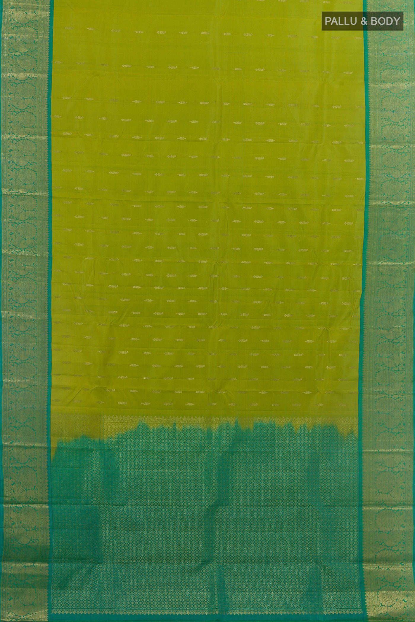 Flat view of Green Kanchipuram Silk Saree with Zari Butta on the body and Zari Border. 