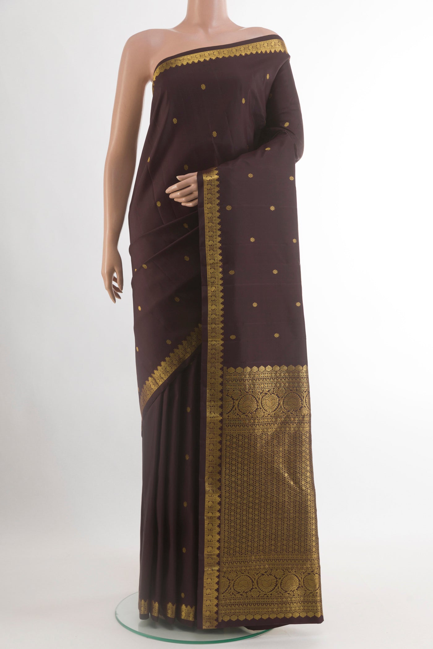 Brown Kanchipuram Silk Saree with Zari Butta on the body and Zari Border.  displayed on a mannequin