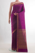 Pure Silk Magenta Kanchipuram Saree with Zari Butta on the body and Zari Border.  displayed on a mannequin